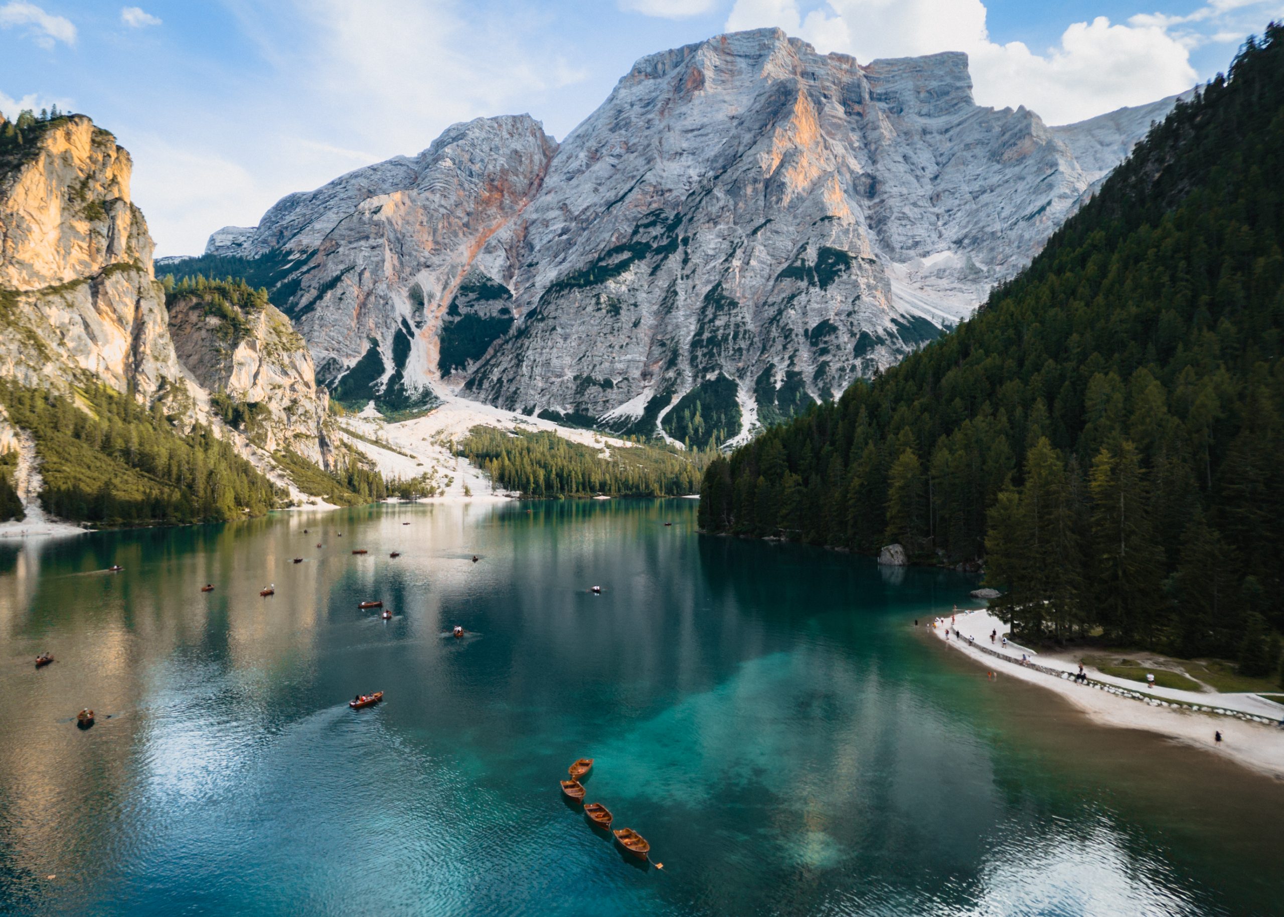 Sunny aerial shot of Lago di Braies in the Dolomotes.