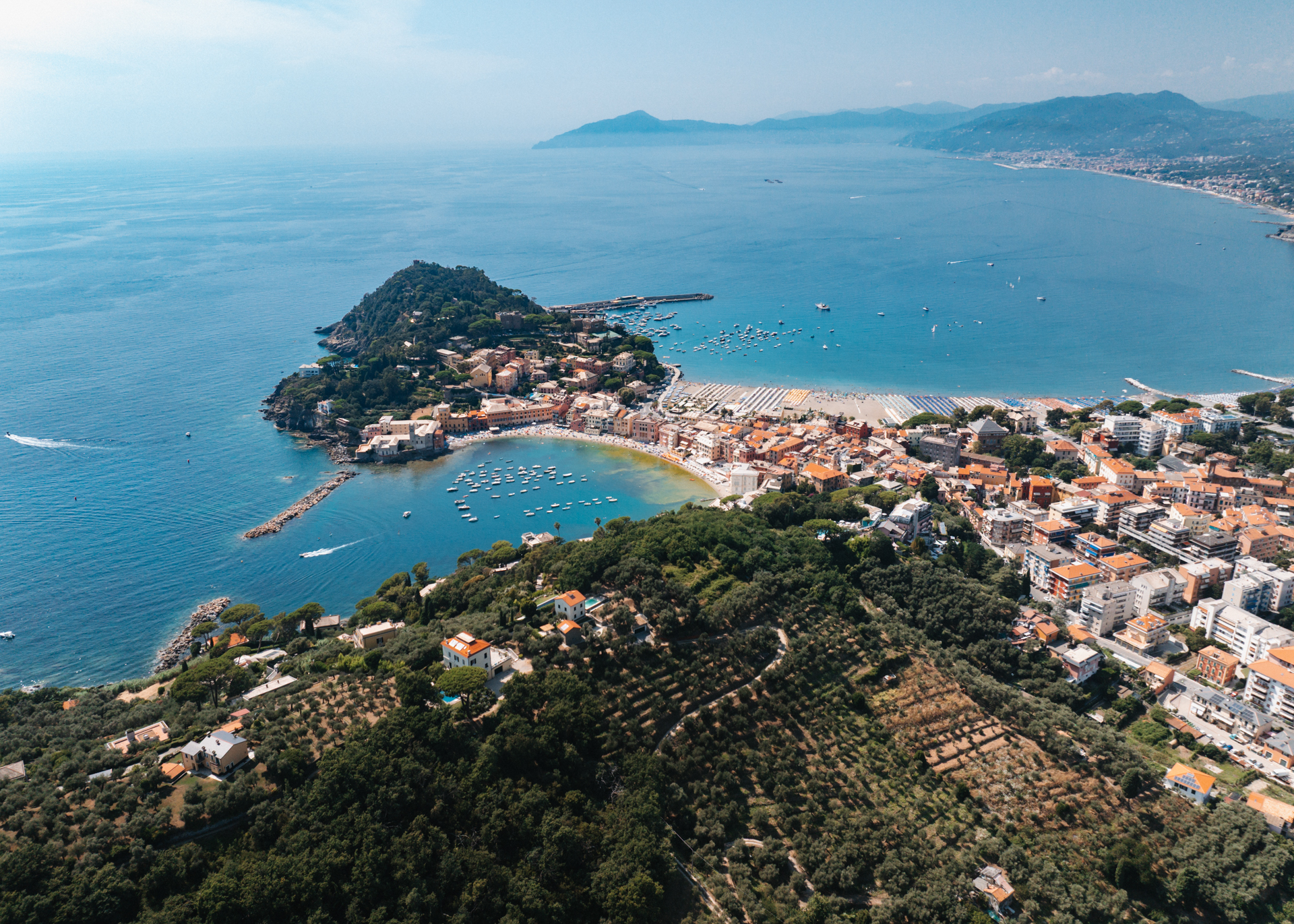 Aerial view of Sestri Levante showing the Bay of Silence, beaches, and surrounding blue sea.