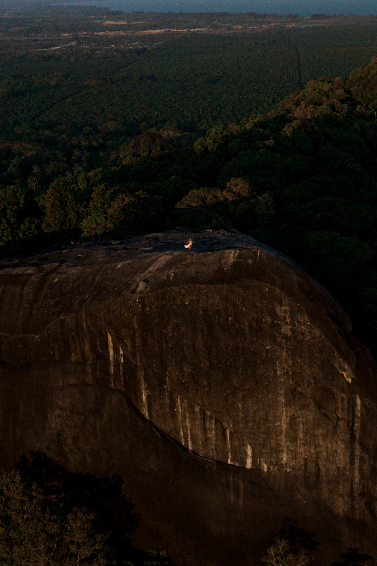 Drone view of massive Batu Baginda granite rock formation in Belitung tropical scenery