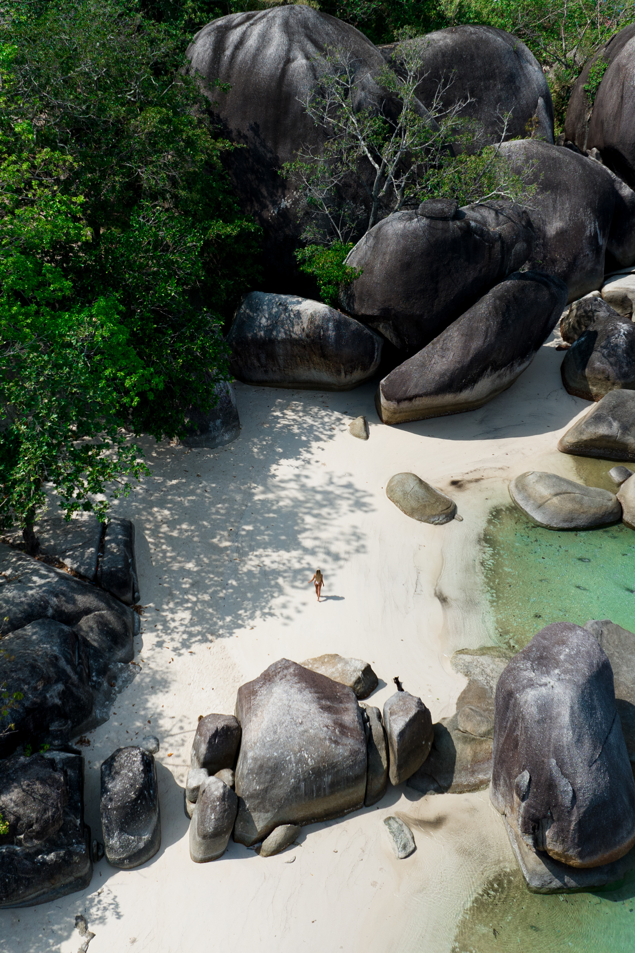 Aerial view of Belitung Tanjung Tinggi Beach with granite boulders and turquoise water
