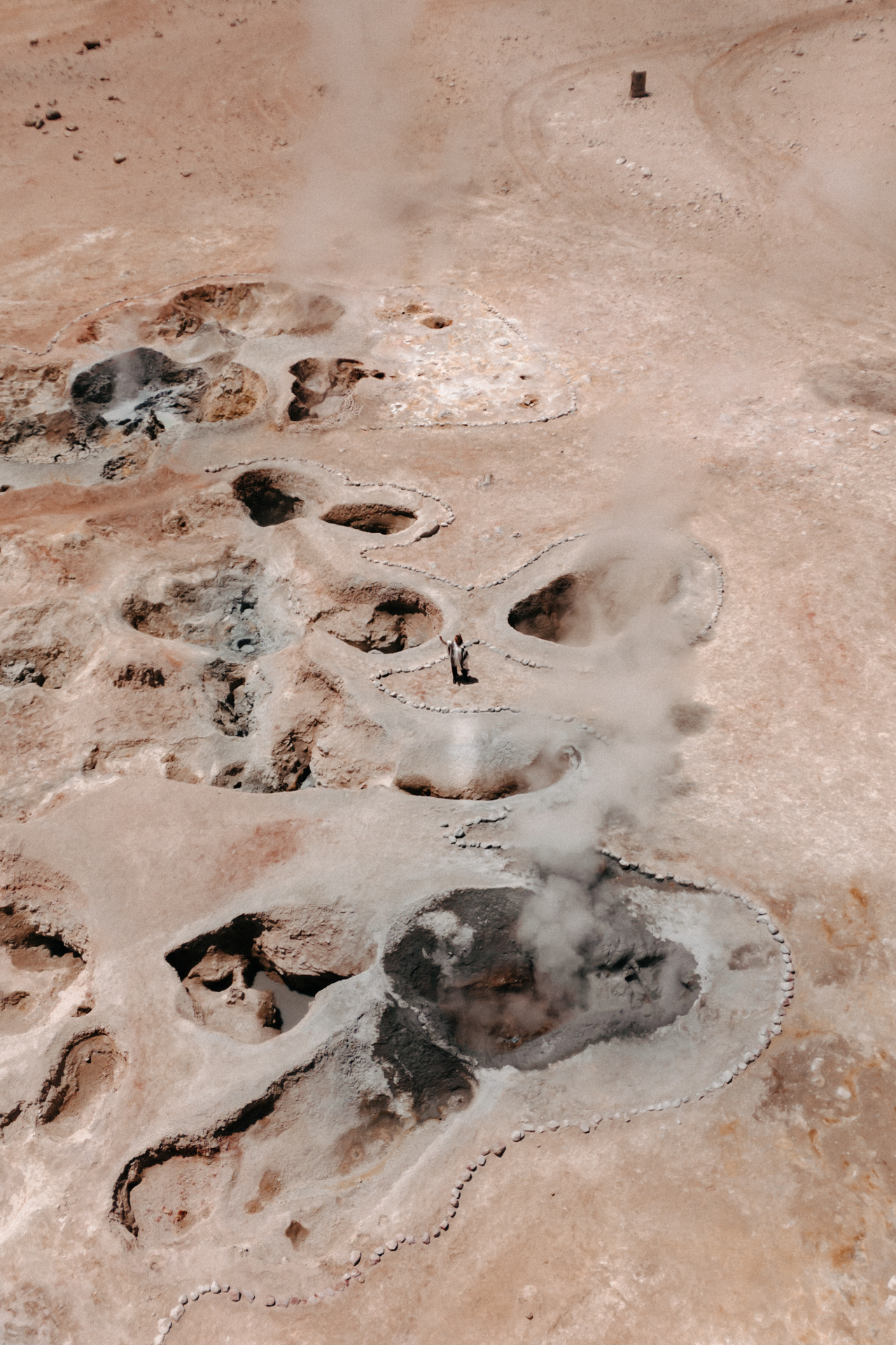 Aerial view of steaming geothermal mud pools at Sol de Mañana geyser field in Eduardo Avaroa National Reserve, Bolivia.