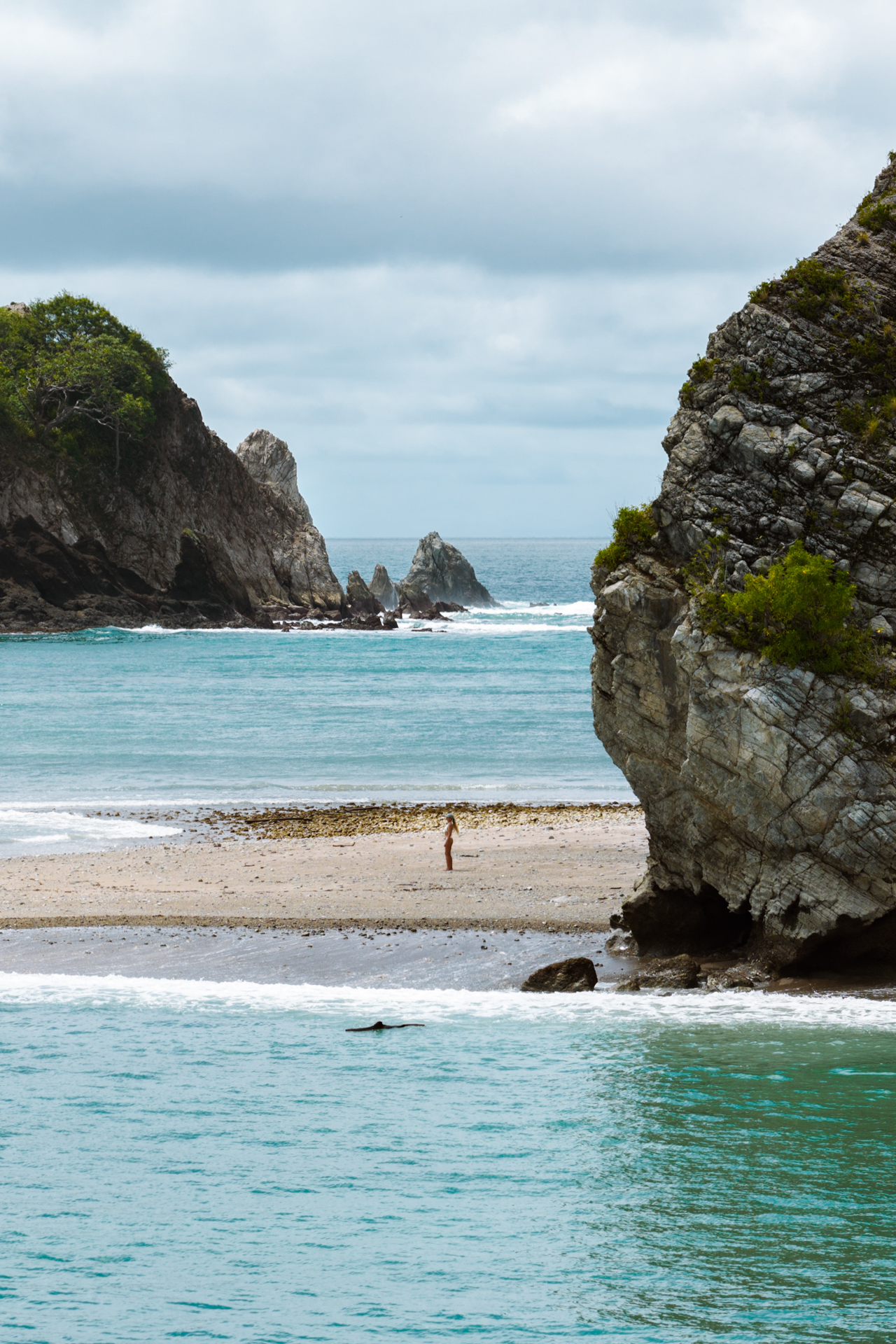 Secluded rocky beach with turquoise water in Costa Rica