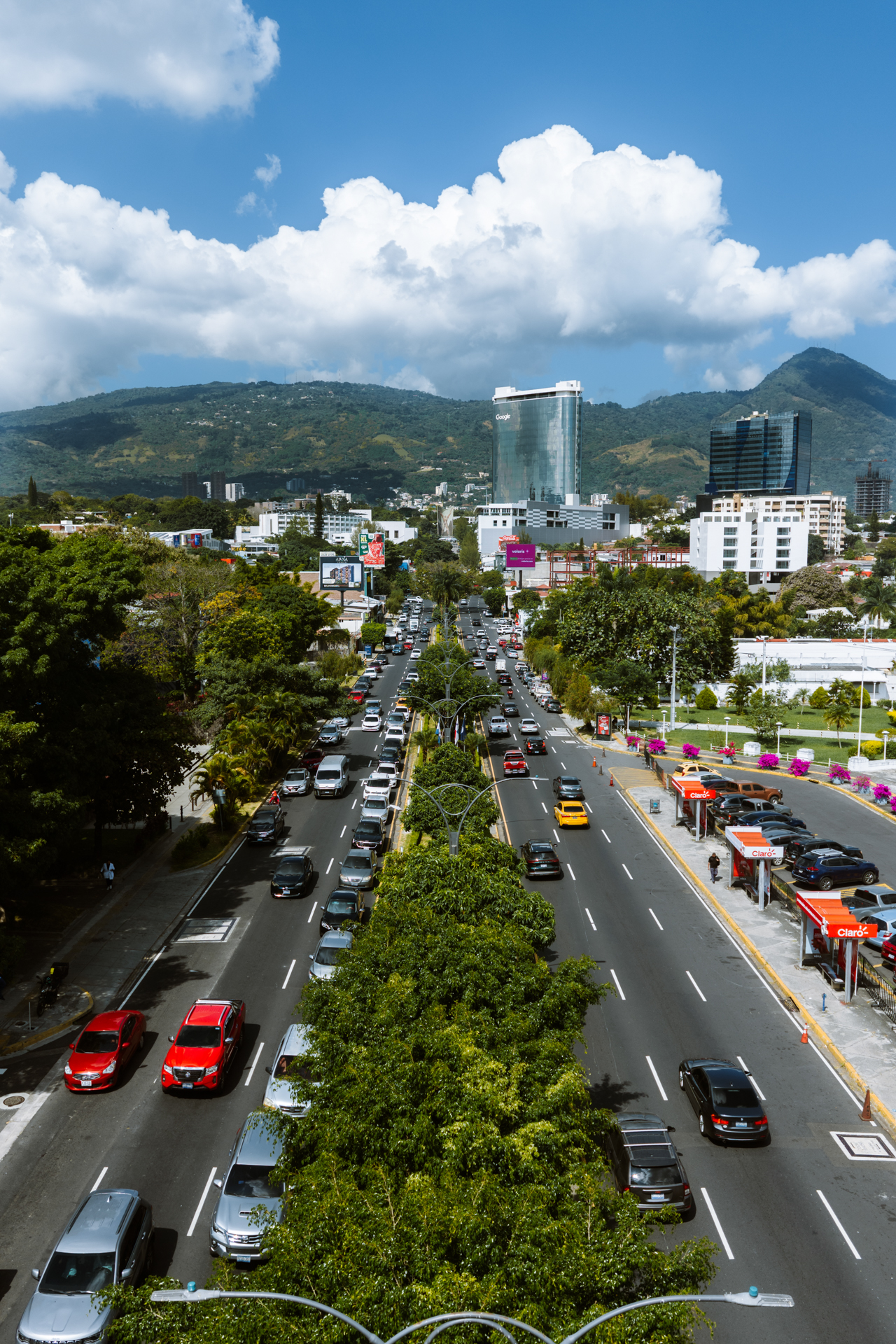 San Salvador skyline with busy boulevard and mountains, El Salvador