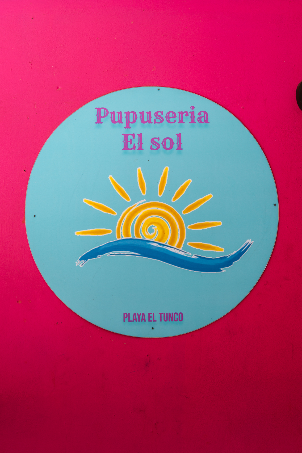 Colorful Pupuseria El Sol sign in Playa El Tunco, El Salvador
