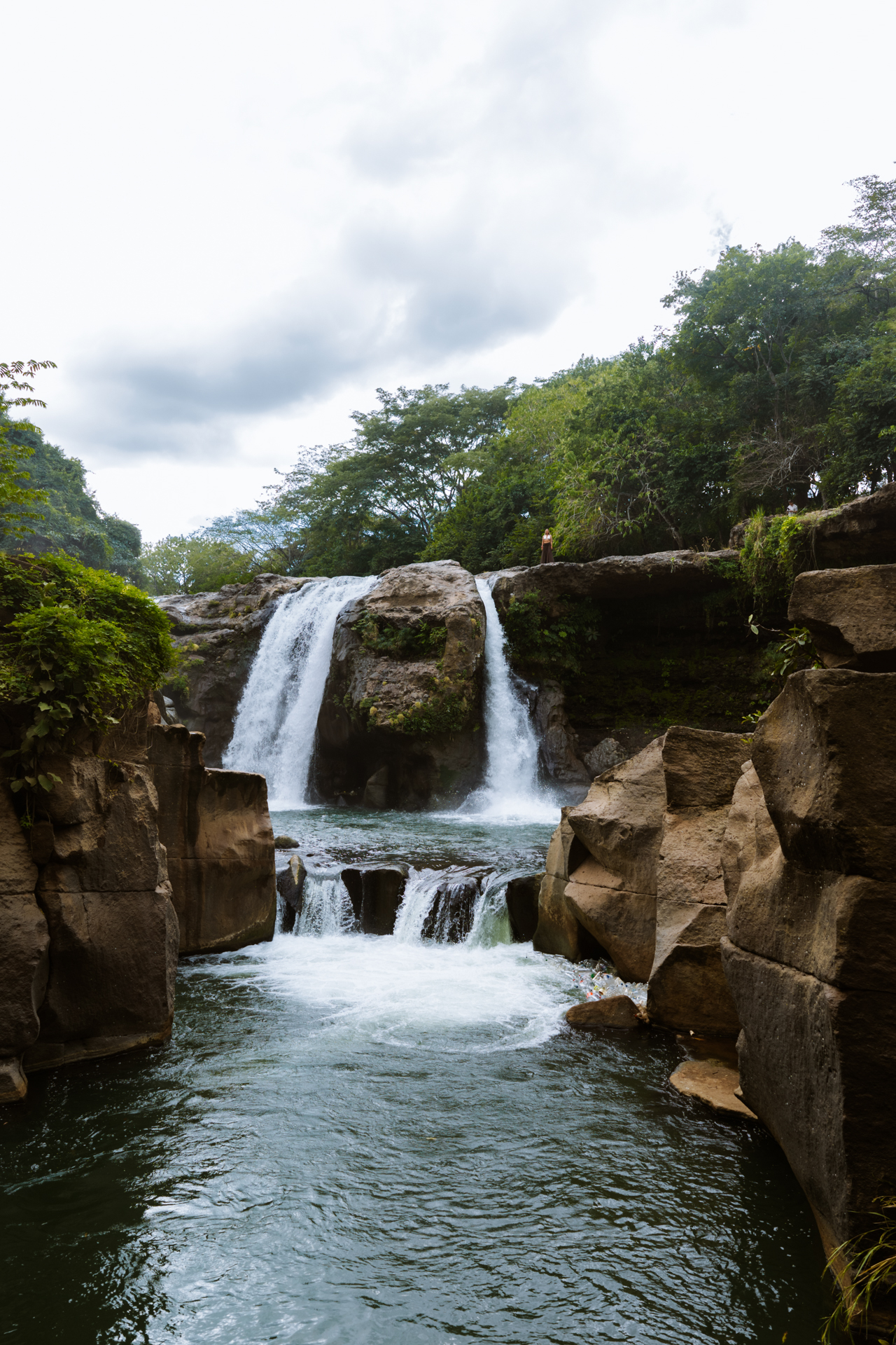 Scenic Malacatiupán Waterfall and rock formations in El Salvador.