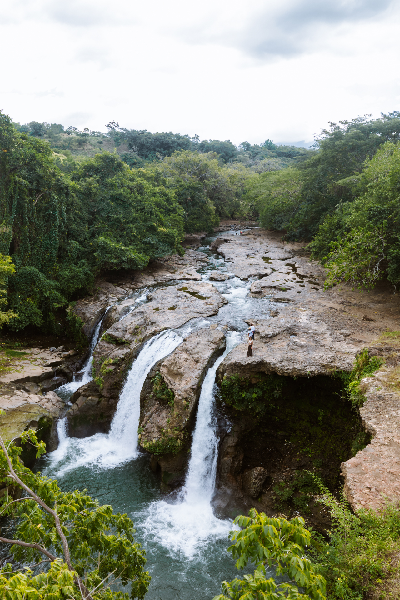 Aerial view of Malacatiupán Waterfall and river landscape, El Salvador.