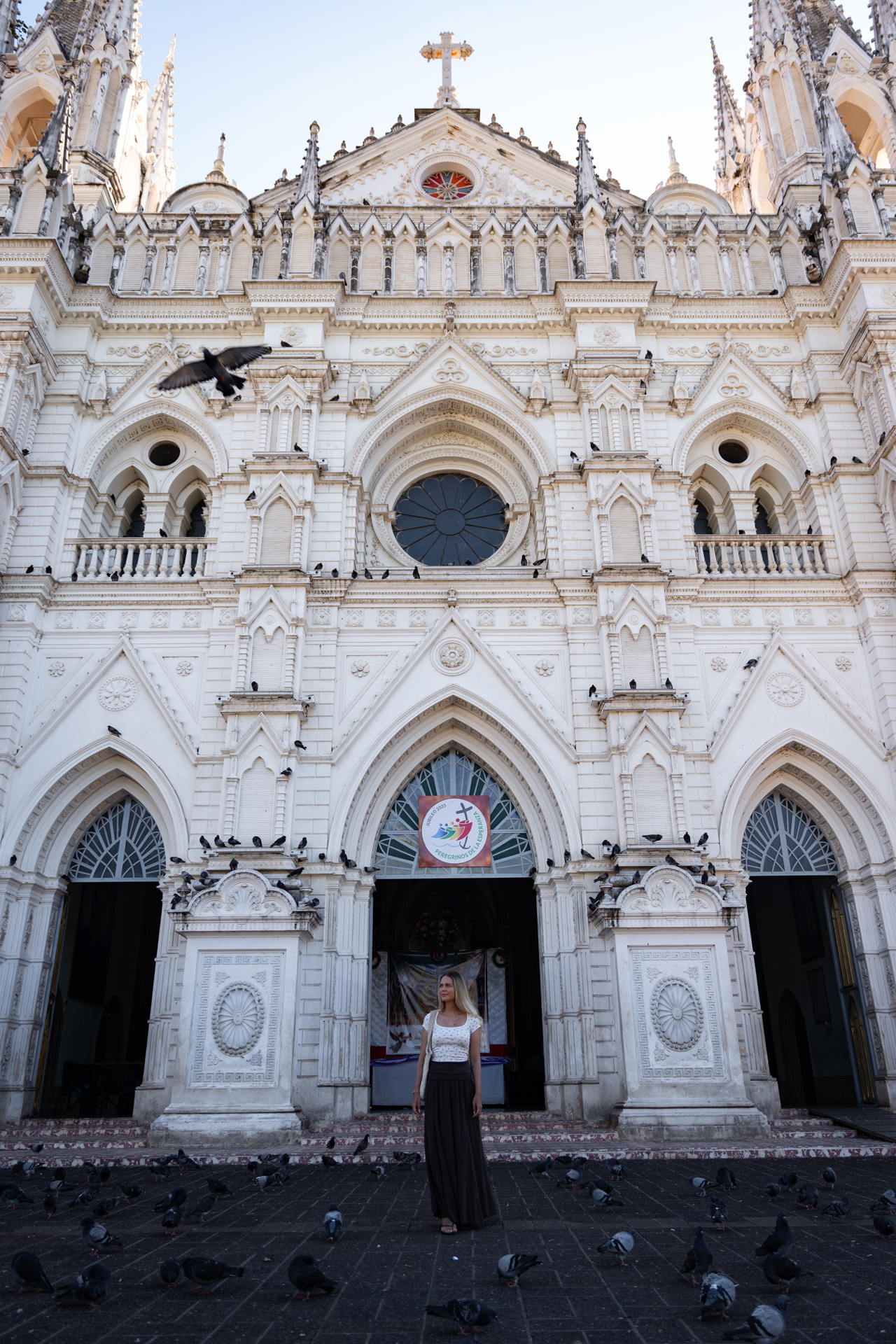 Woman at Santa Ana Cathedral with pigeons, Santa Ana, El Salvador