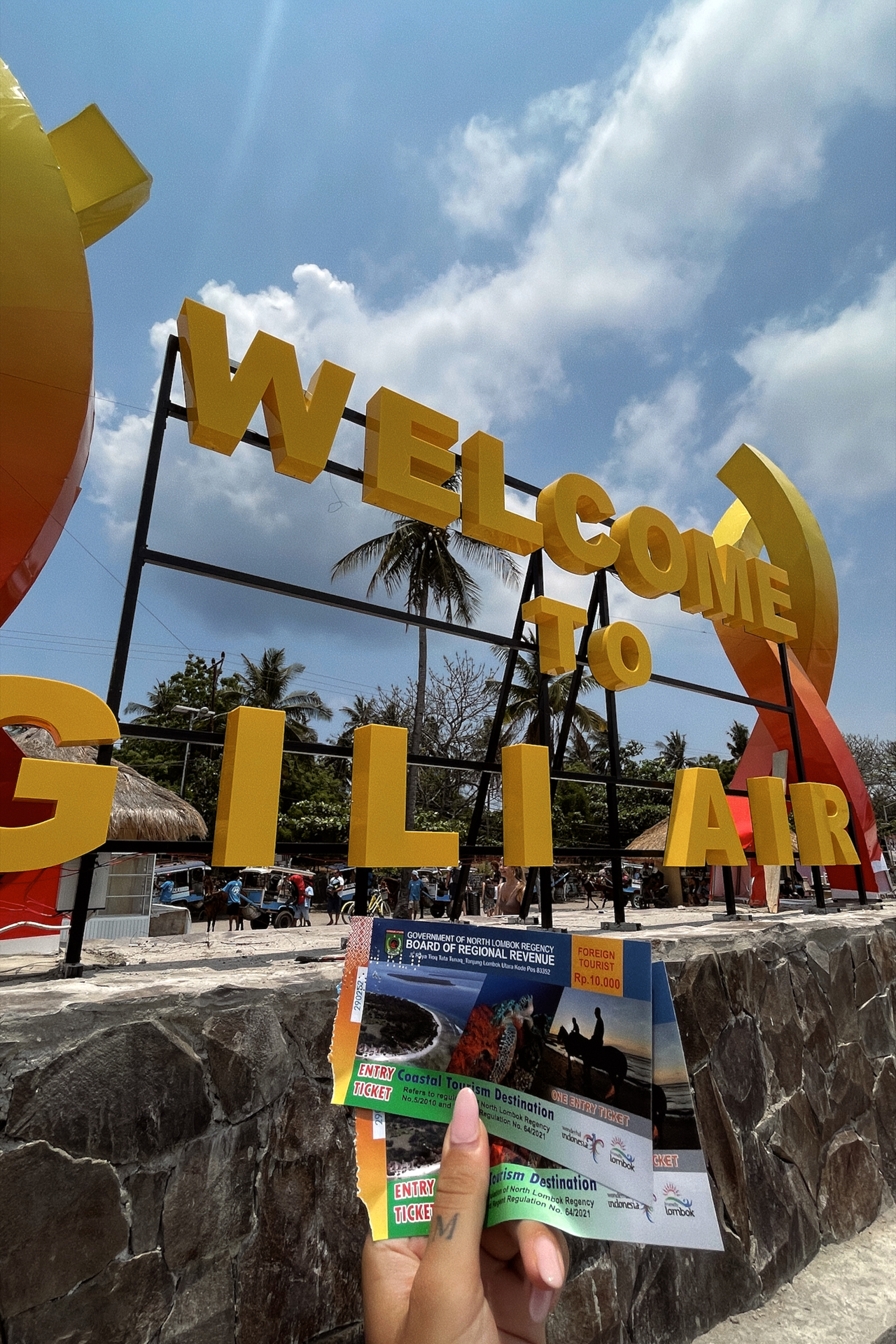 Welcome sign at Gili Air harbor with entry tickets, Lombok