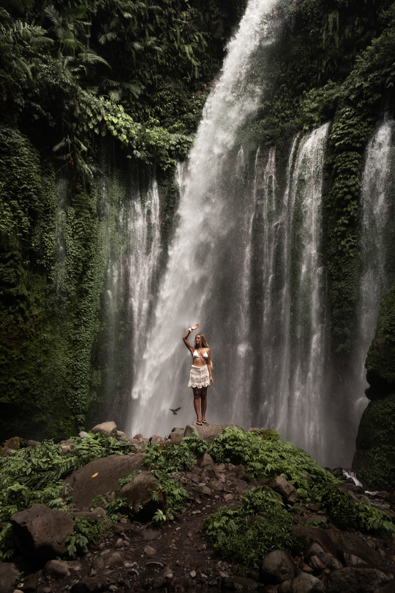 Tiu Kelep Waterfall Lombok with lush jungle and cascading tropical falls