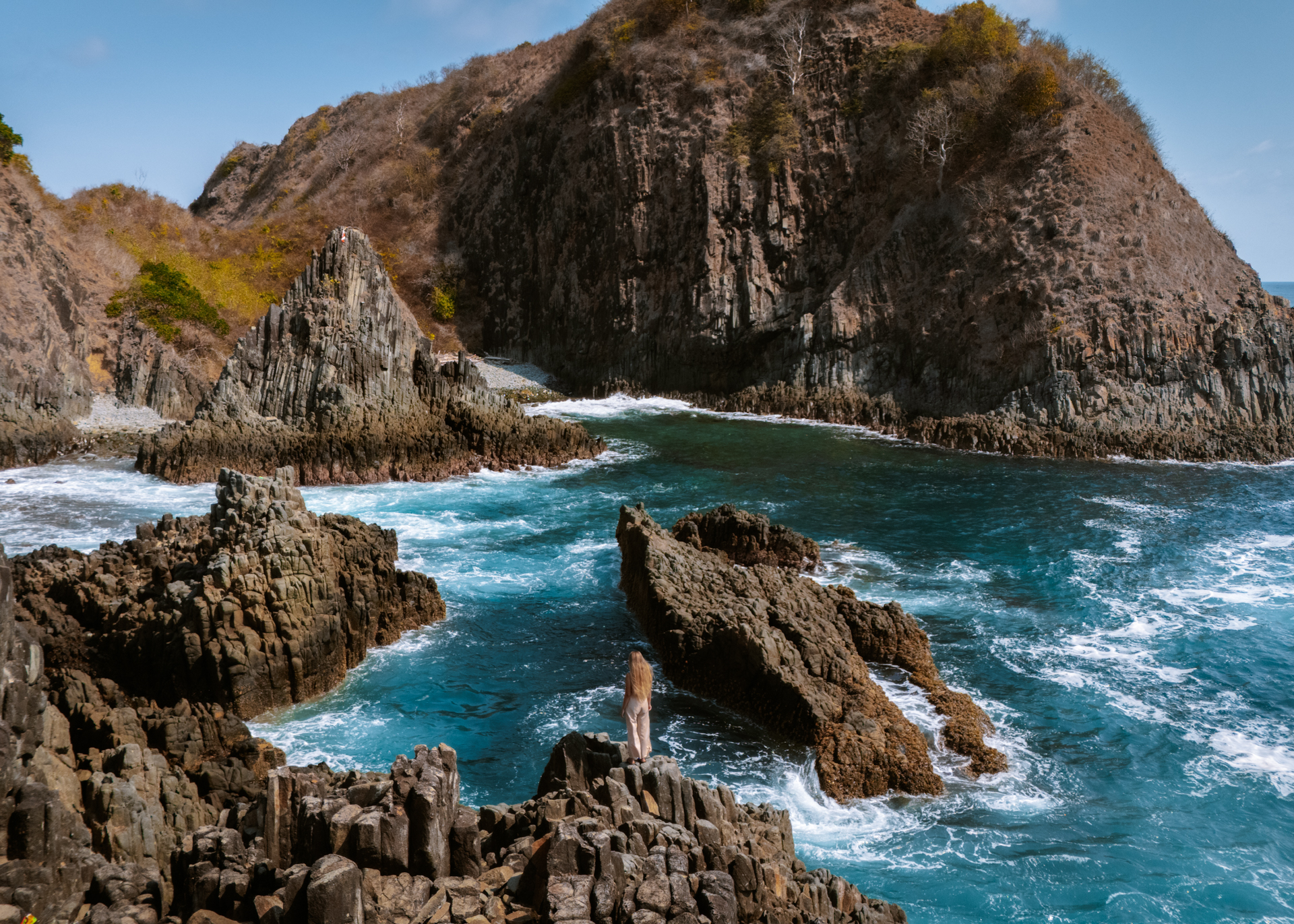 Semeti Hills Lombok with dramatic volcanic rocks and turquoise ocean views
