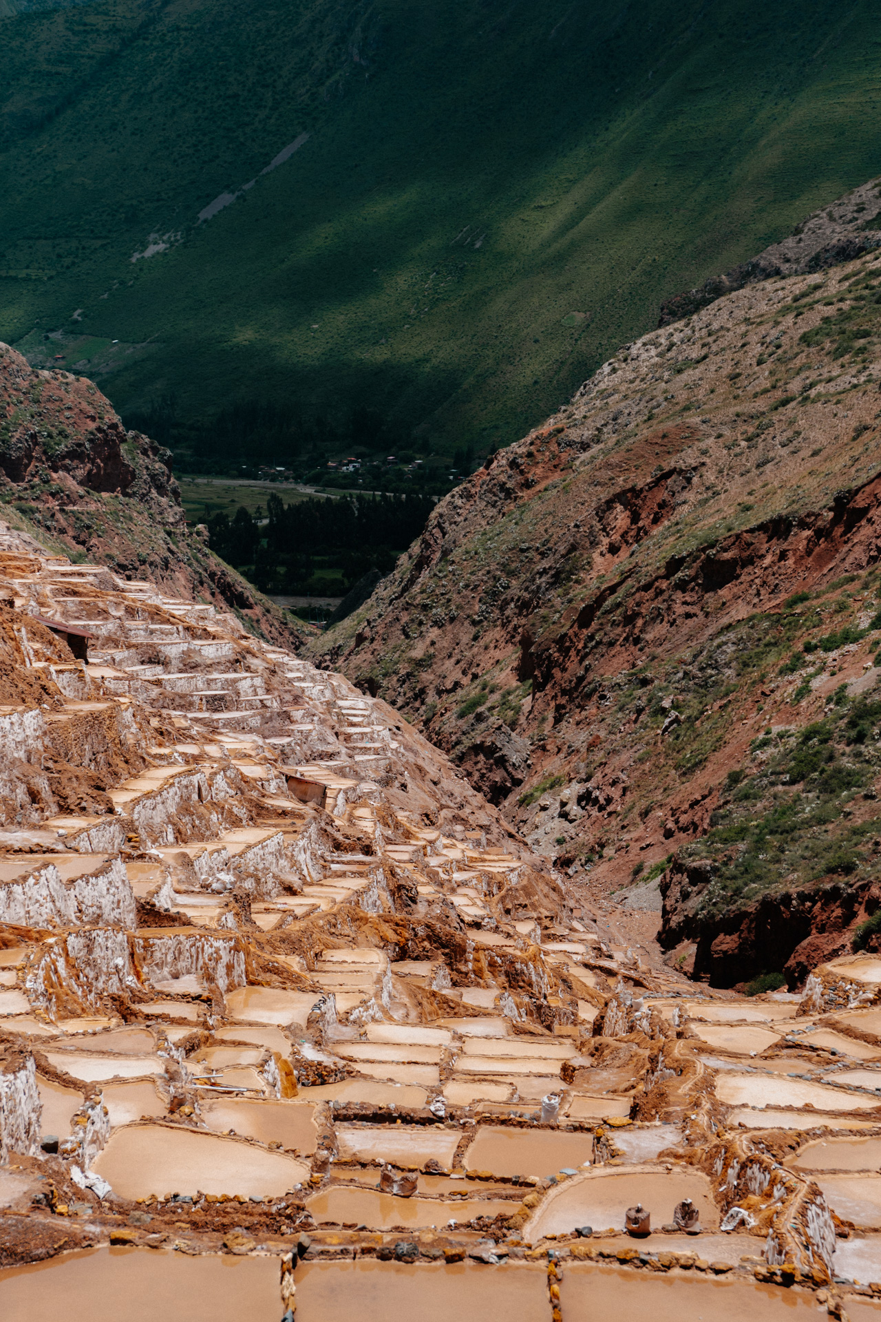 Terraced salt ponds of Maras with mountains in the Sacred Valley, Pe