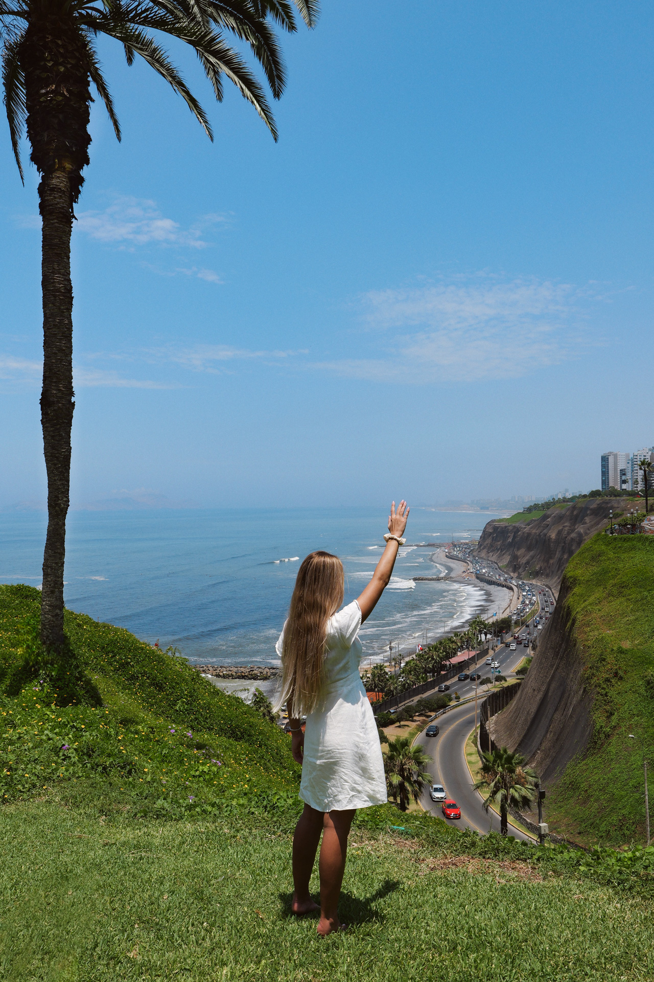 Traveler overlooking Lima’s coastal cliffs and Pacific Ocean from Miraflores