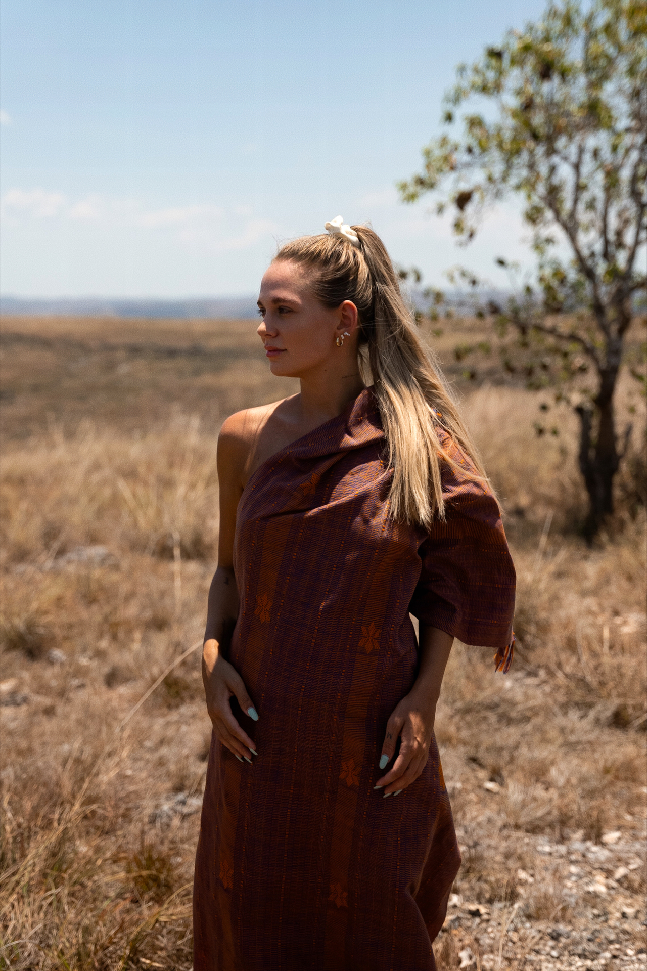 Woman in traditional fabric at Puru Kambera Savannah, Sumba Island