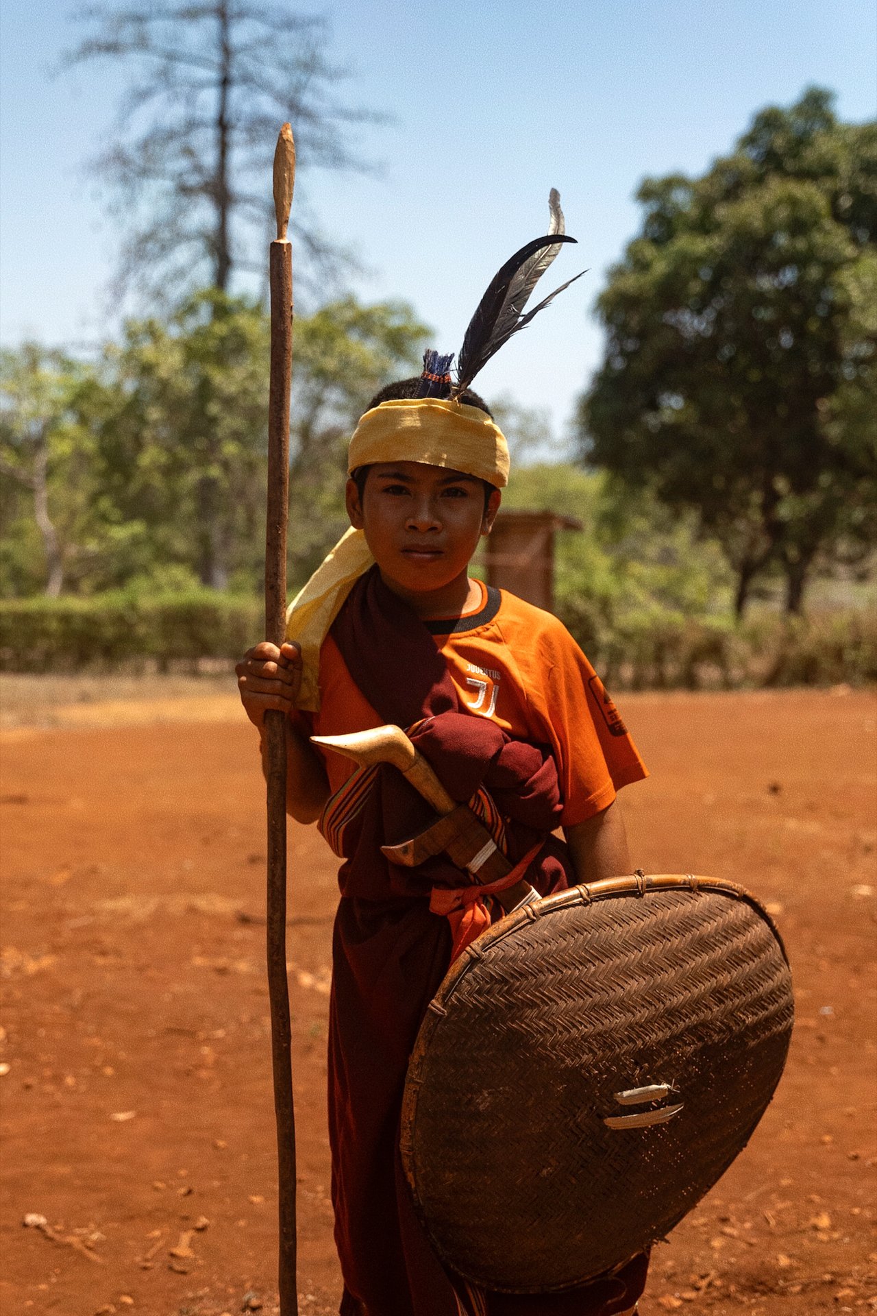 A local in Sumba in Indonesia wearing traditional clothes.