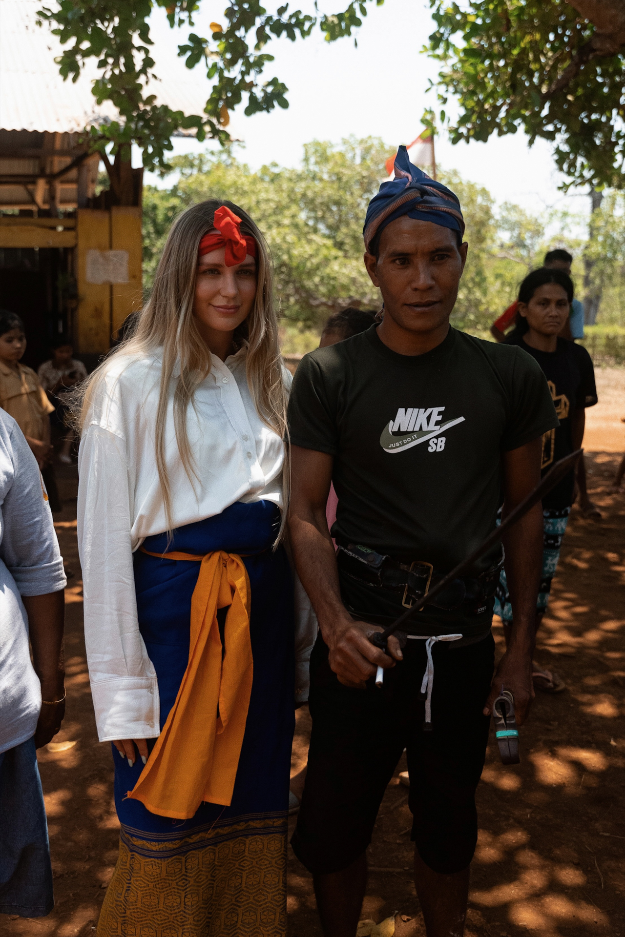 Woman with local man in traditional village, Sumba Island