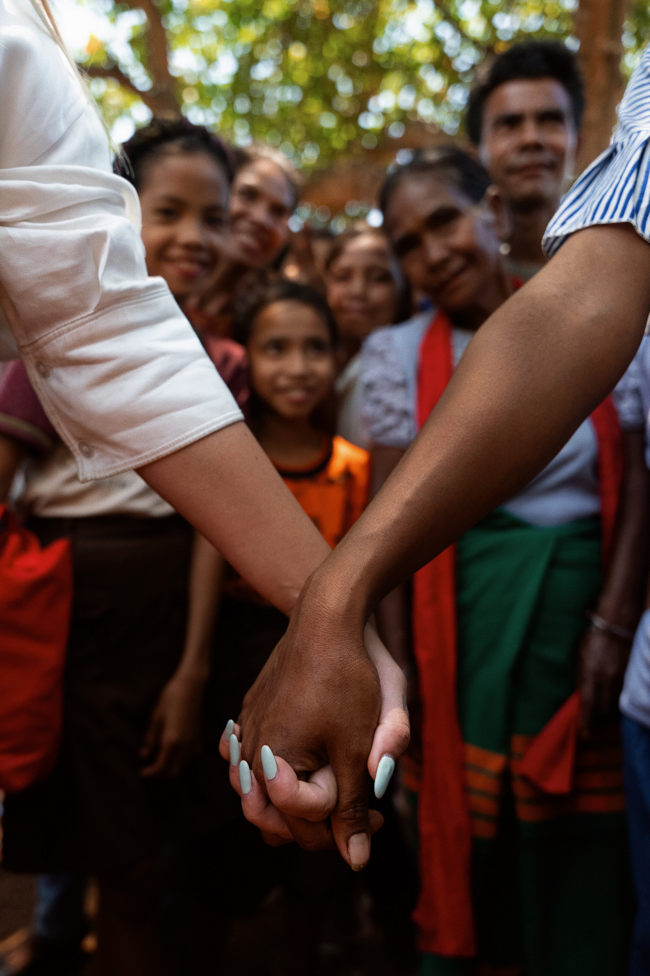 Holding hands with local villagers, Sumba Island