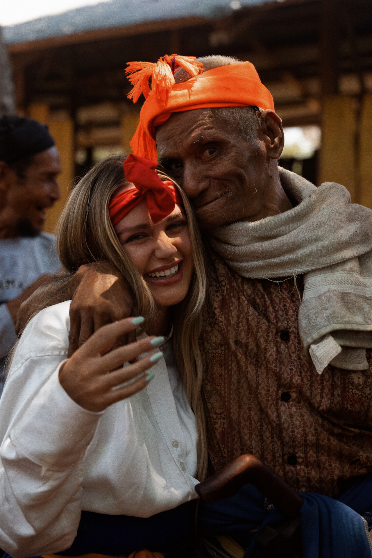 A tourist with a local connected on Sumba in Indonesia.