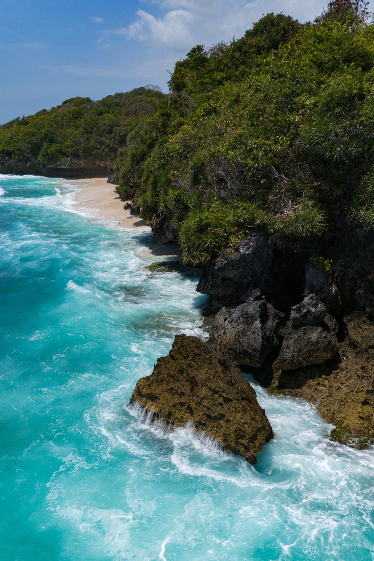 Turquoise waves and rocky coastline, Sumba Island