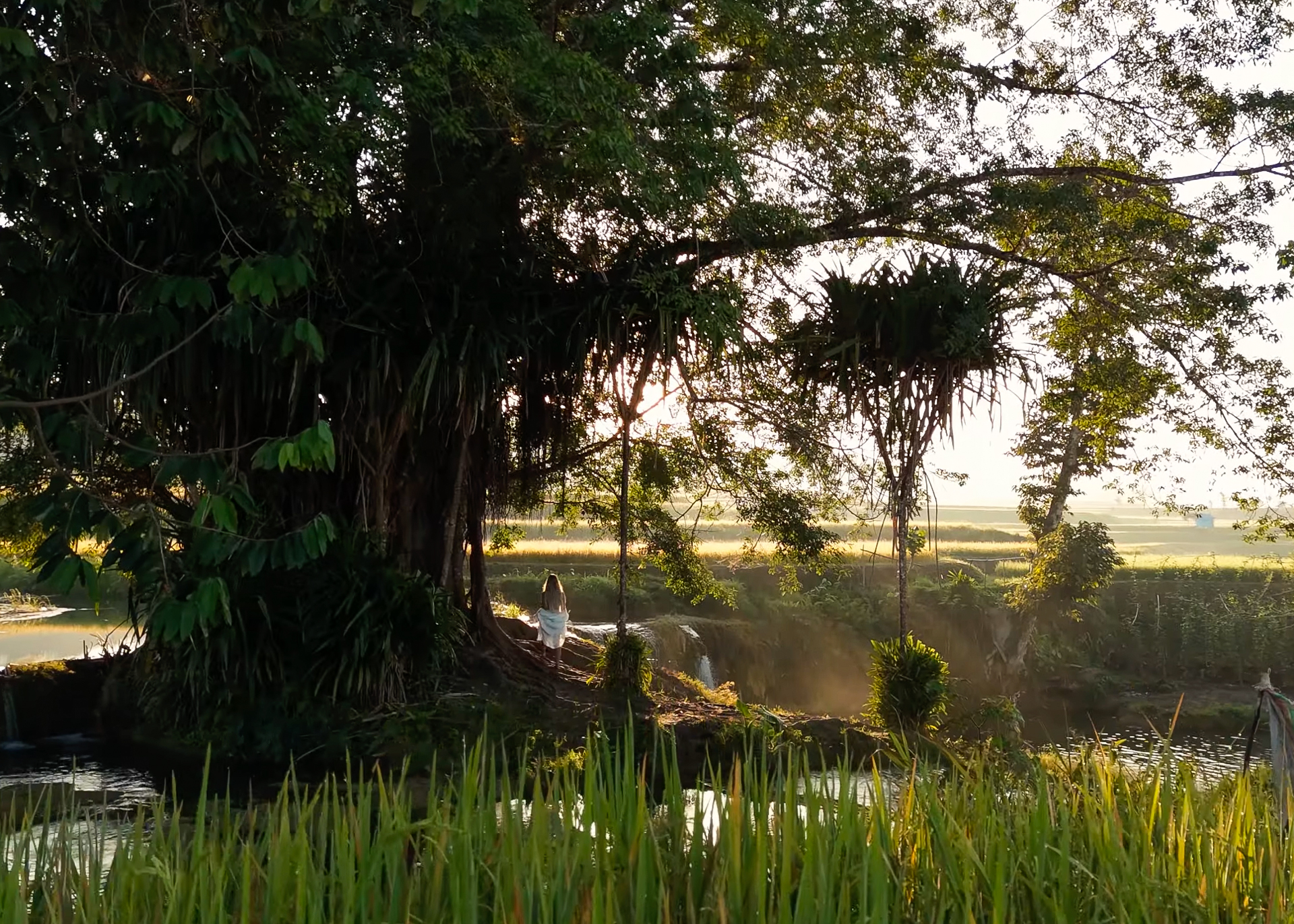 Woman walking in weekacura waterfalls in Sumba Island