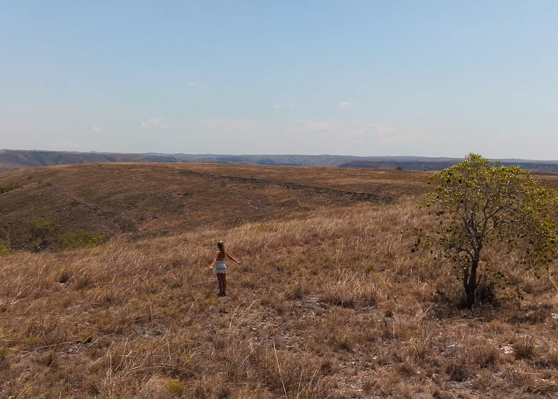 Woman standing at Puru Kambera Savannah, Sumba Island