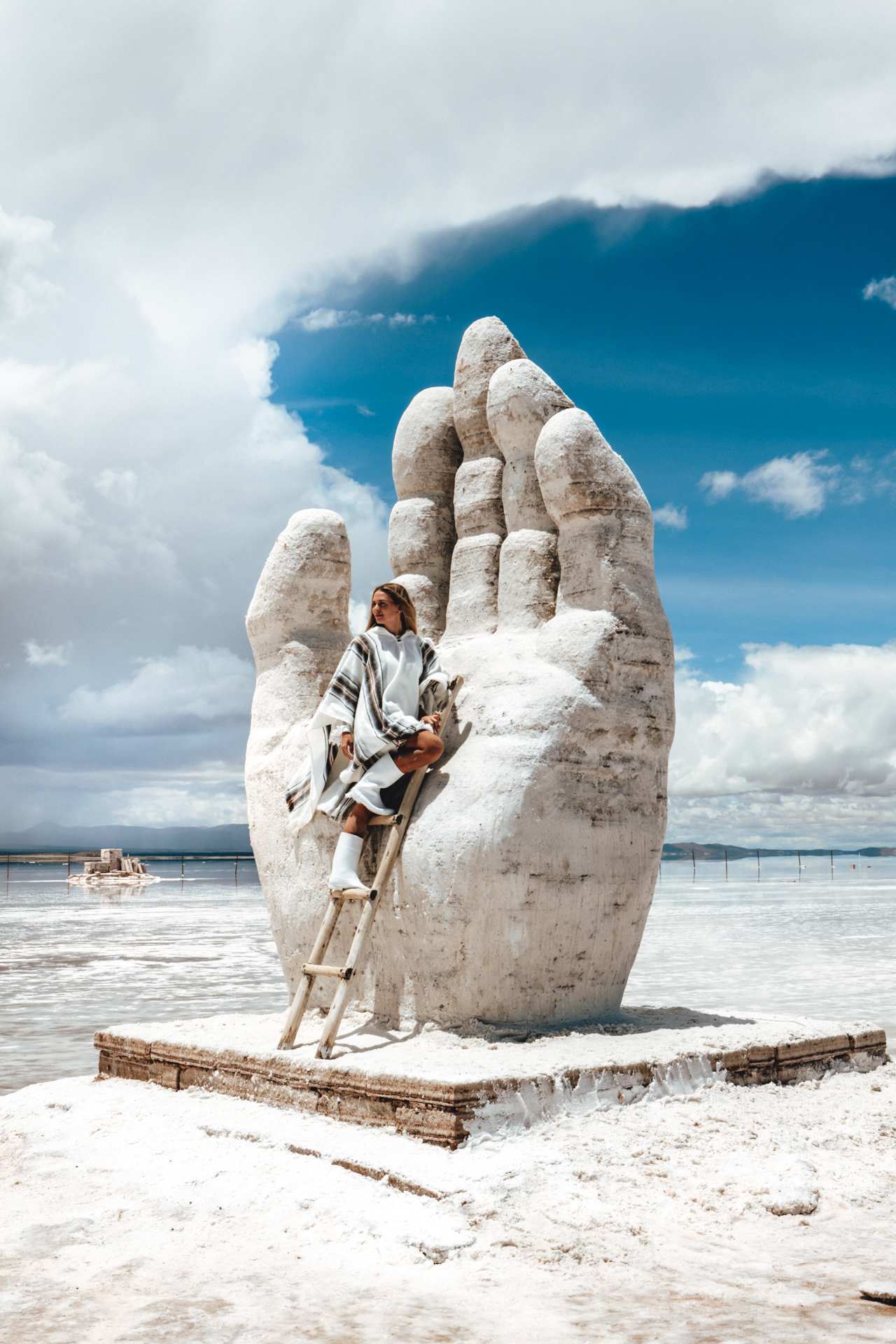 Big hand sculpture on Salar de Uyuni Salt Flats in Bolivia
