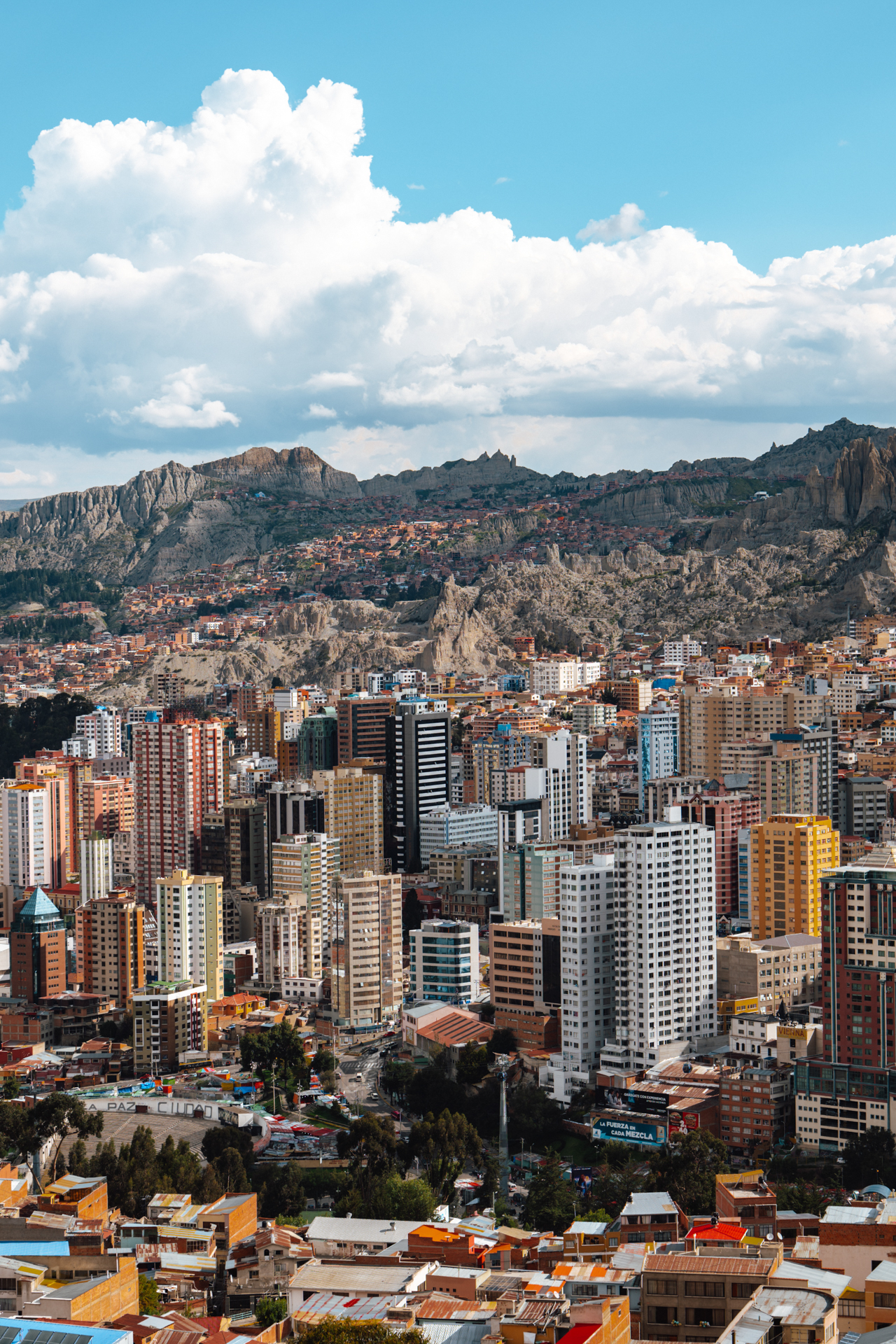A panoramic view of La Paz nestled in the Andes, where colorful buildings meet rugged mountain landscapes.