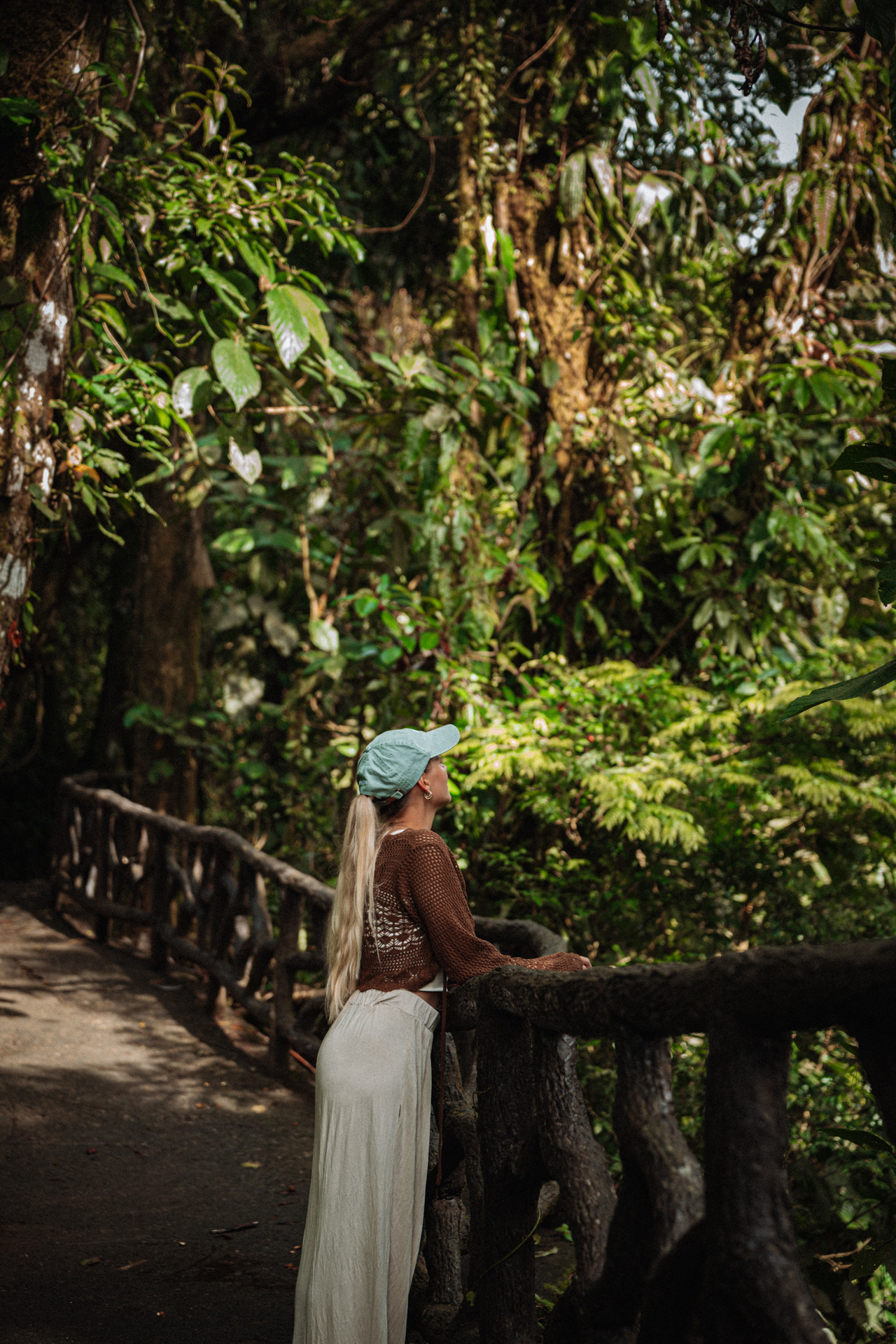 Woman enjoying a rainforest view at Mistico Arenal Hanging Bridges in La Fortuna, Costa Rica