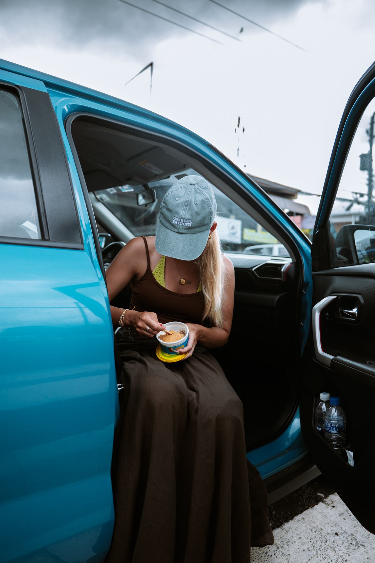 Woman eating traditional ice cream from Costa Rica in the Car