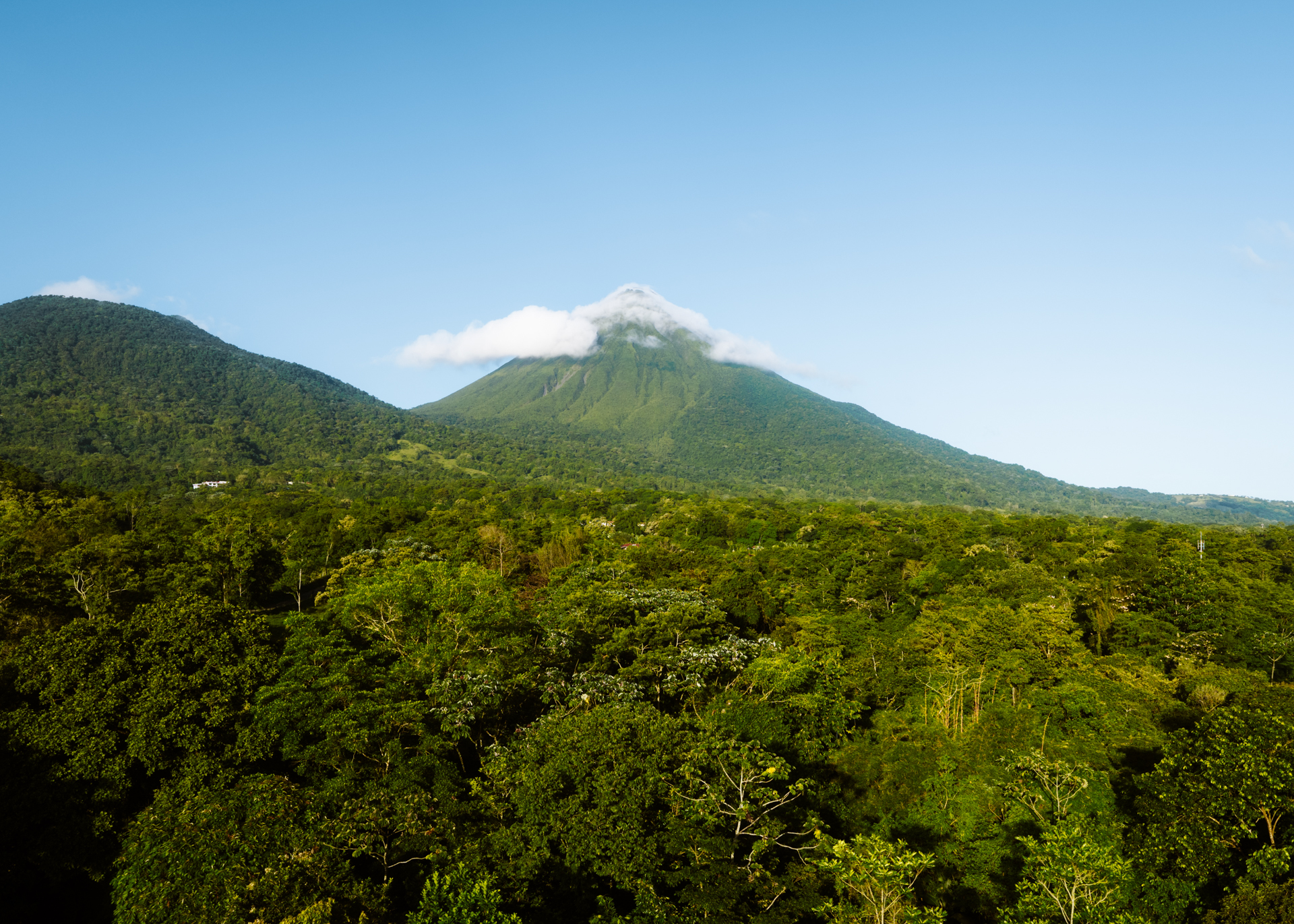 Arenal Volcano rising above lush rainforest near La Fortuna, Costa Rica