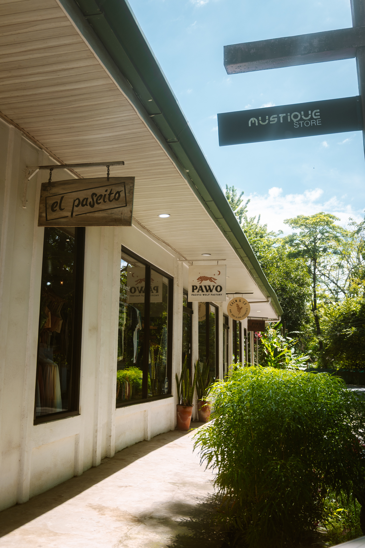 Shopping street in Santa Teresa Costa Rica with boutique stores and tropical plants