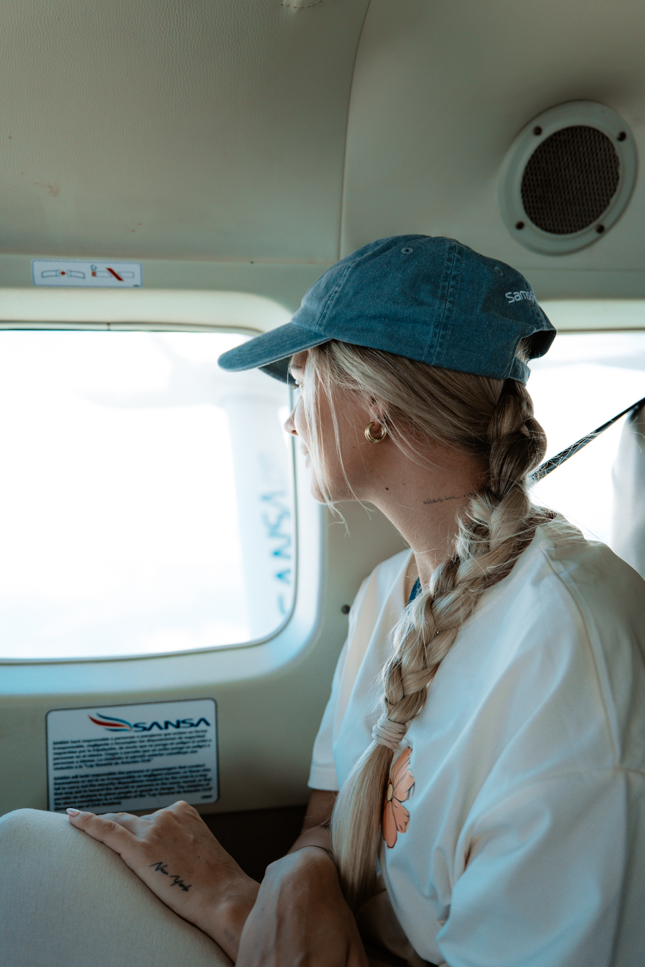 Flying in a small plane over Costa Rica with a traveler looking out the window