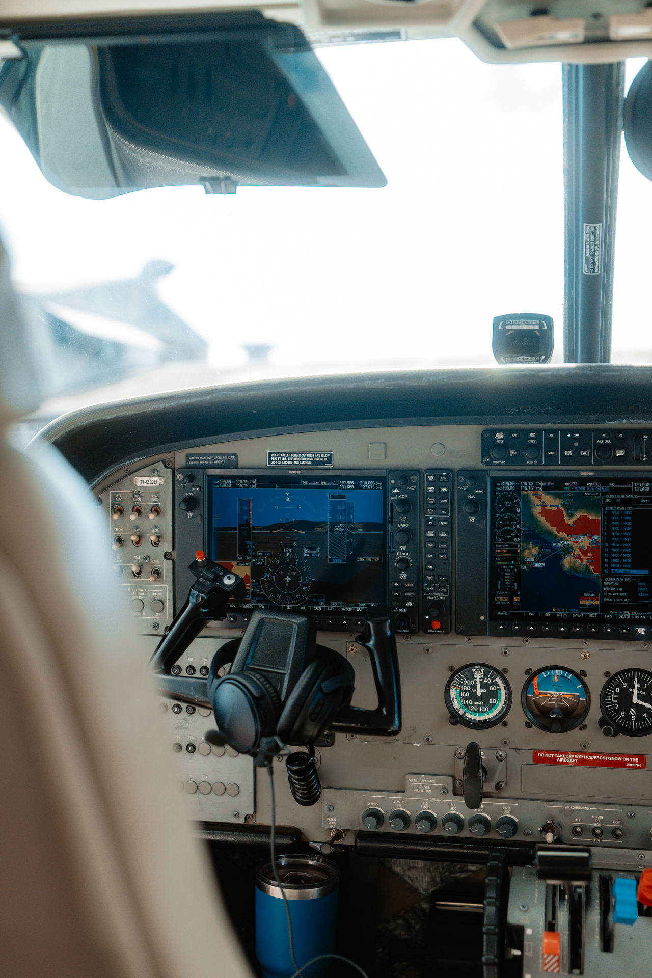 Cockpit of a small plane in Costa Rica with flight instruments and navigation screens