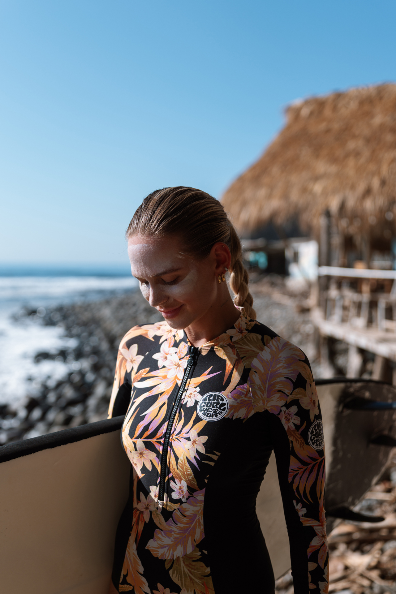 Woman about to surf in El Zonte, El Salvador