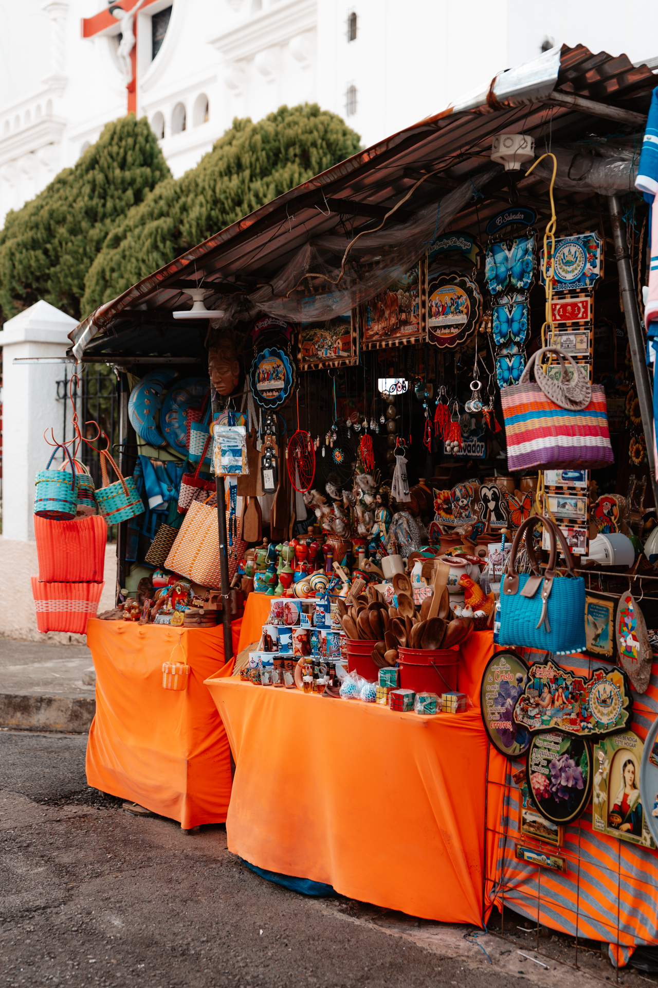 Colorful souvenir stand selling handicrafts and bags in Juayúa on El Salvador’s Ruta de las Flores
