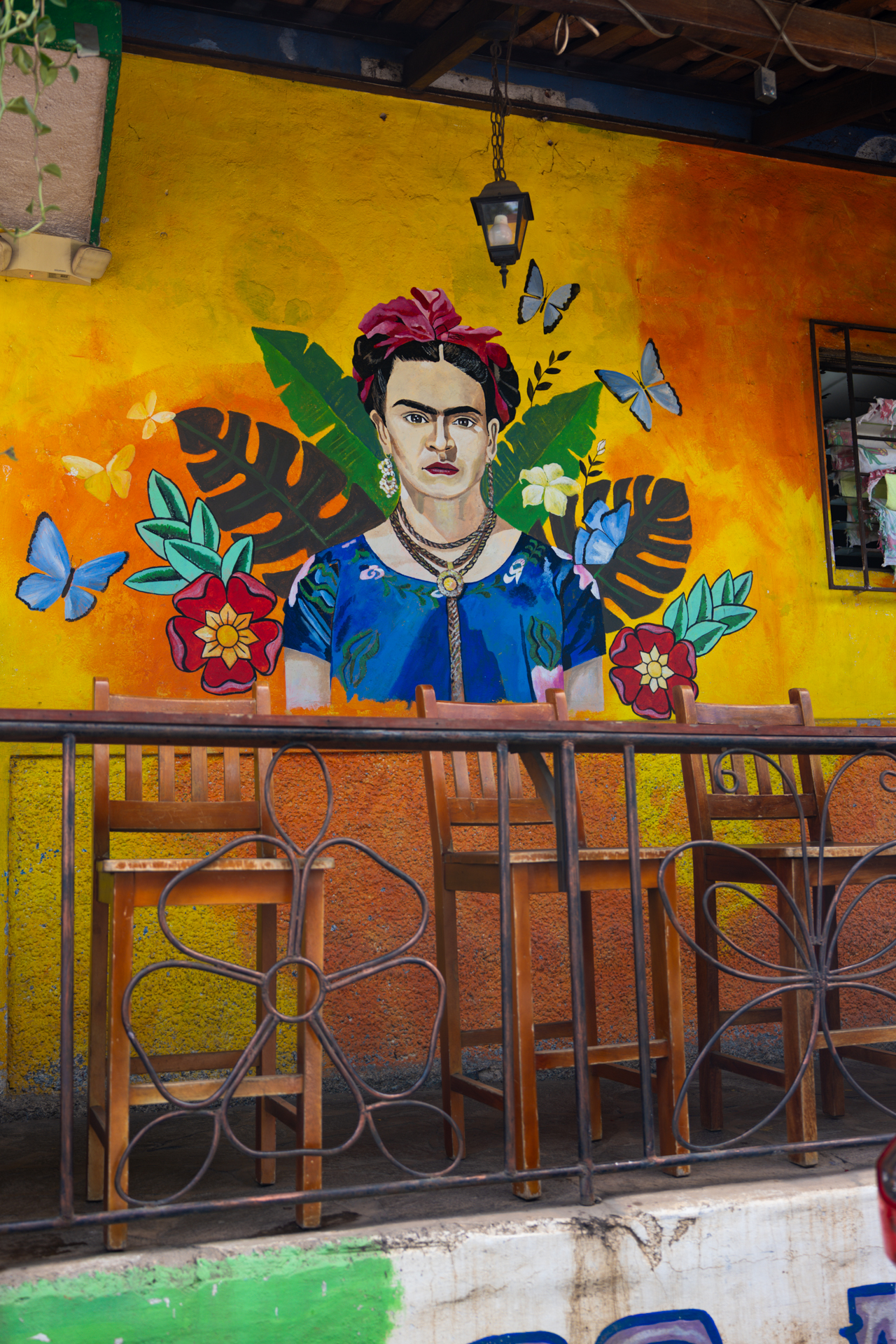 Frida Kahlo mural on a colorful wall in Concepción de Ataco on El Salvador’s Ruta de las Flores