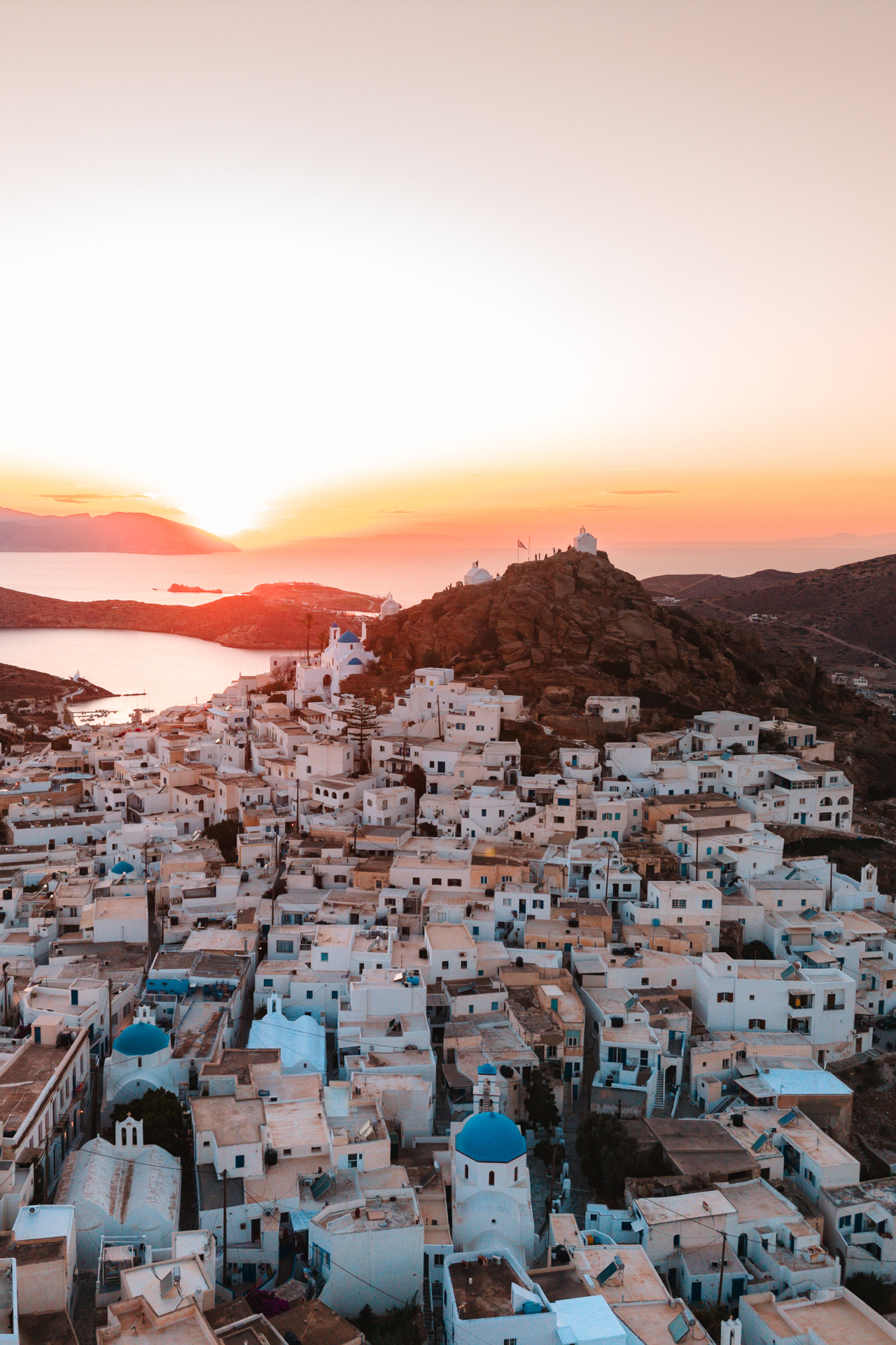 Aerial view of Ios village with white houses and traditional windmill, Cyclades Greece