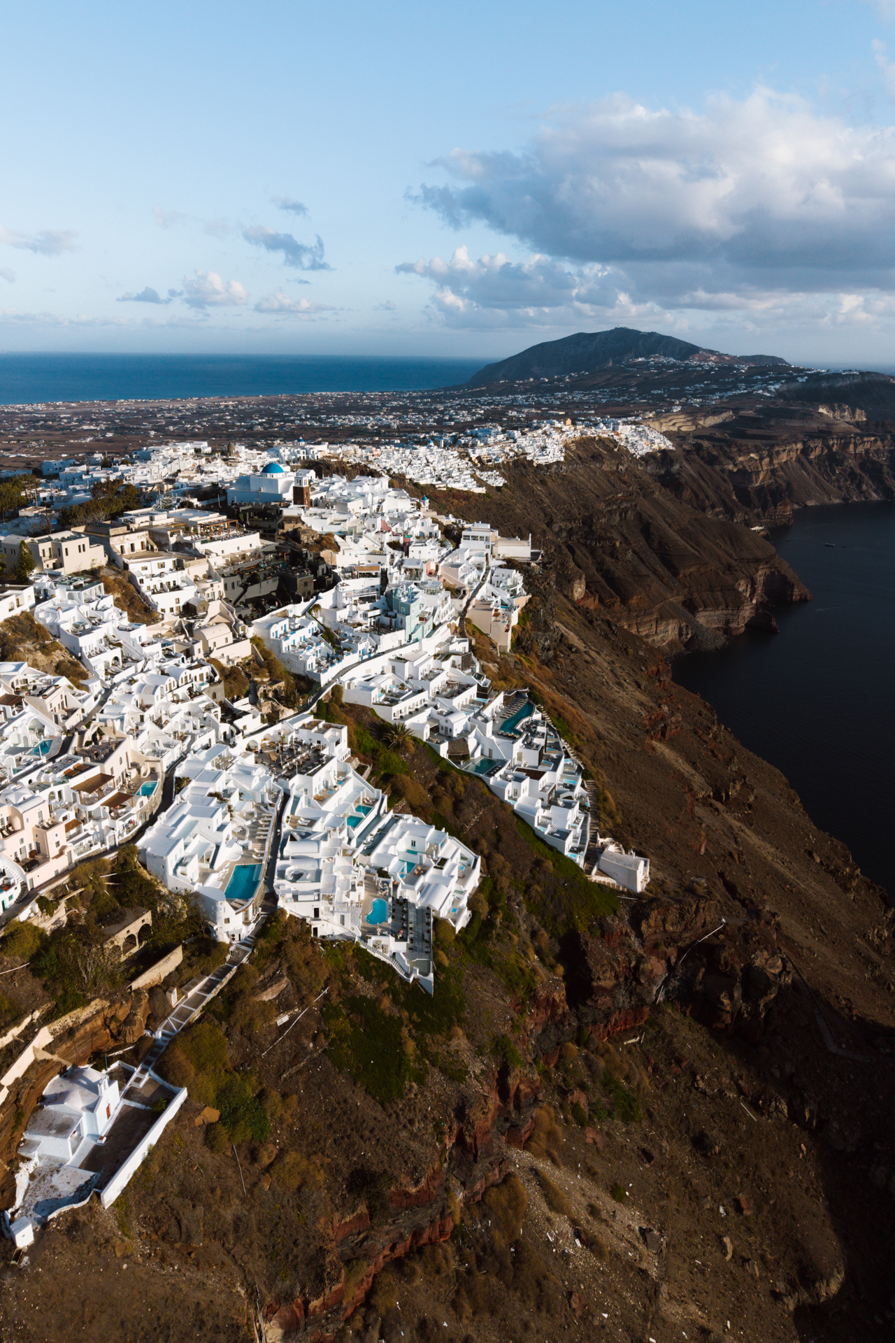 Aerial view of Santorini cliffside houses and caldera, Greece island landscape