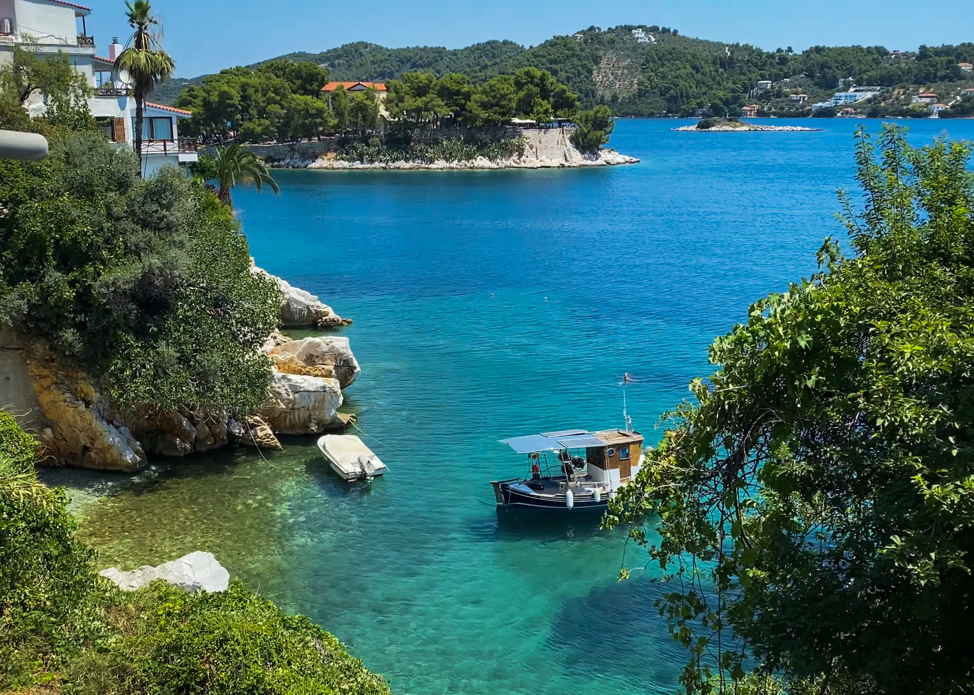 Thassos Skiathos bay with turquoise water and small boats