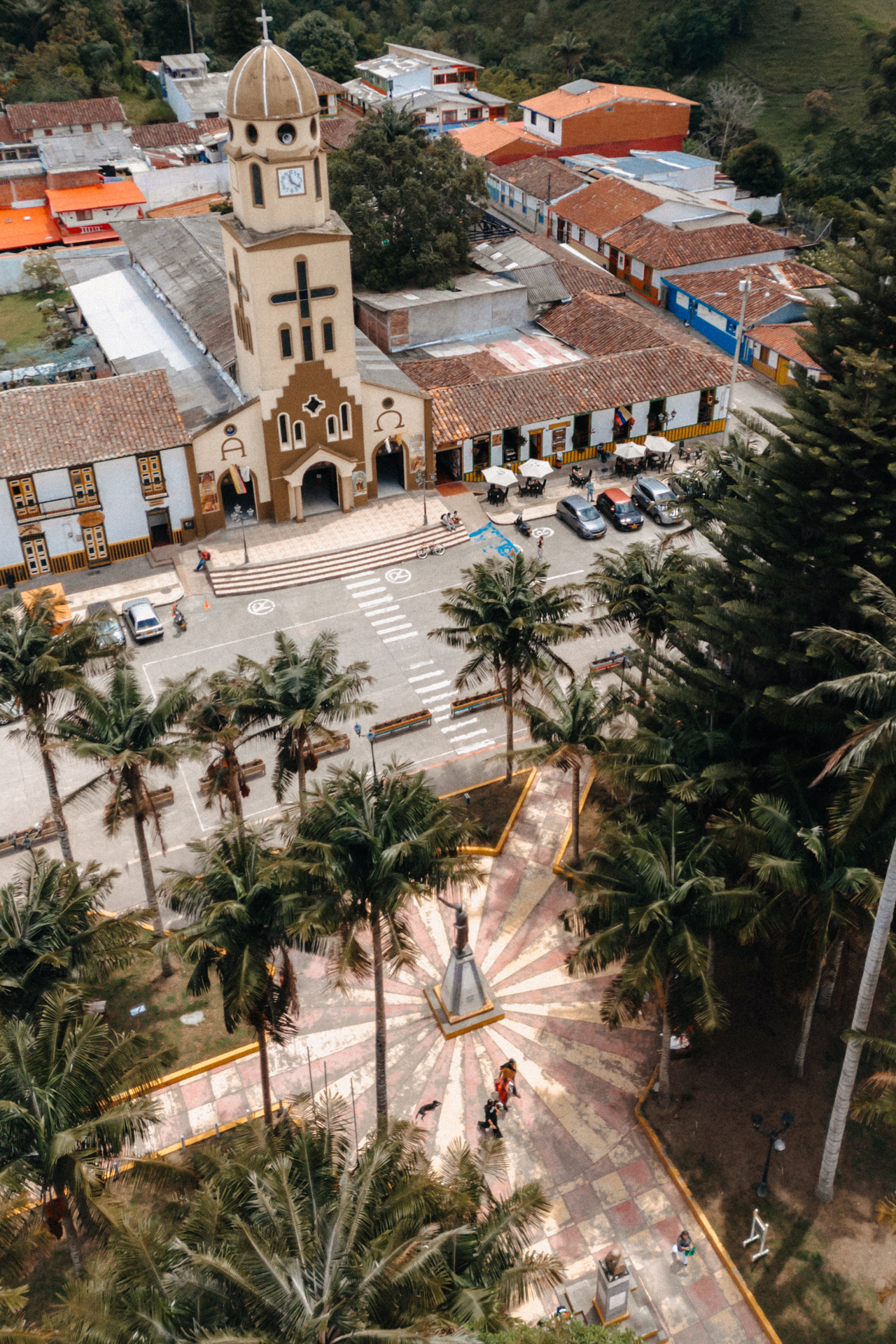 Salento town square aerial with church, palm trees and colorful Colombian village