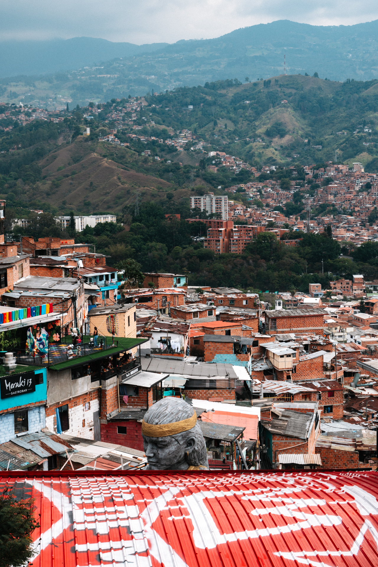 Medellin hillside view with colorful barrios and lush green mountains