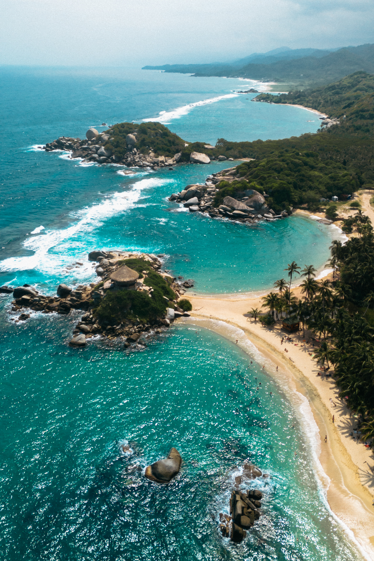Tayrona National Park aerial view with turquoise beaches, jungle coastline and Caribbean sea