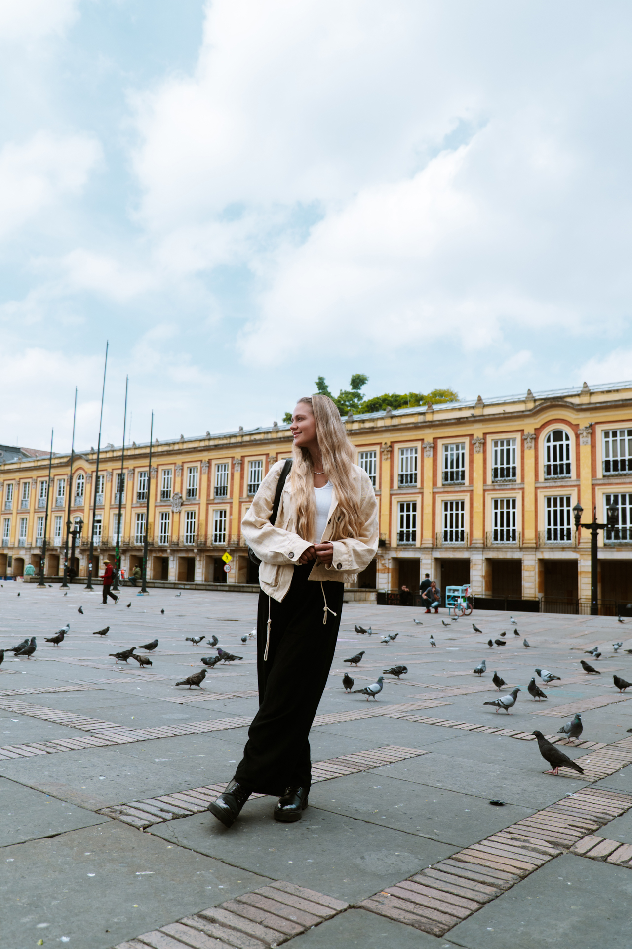 woman at quiet plaza scenes in Bogotá, Colombia.