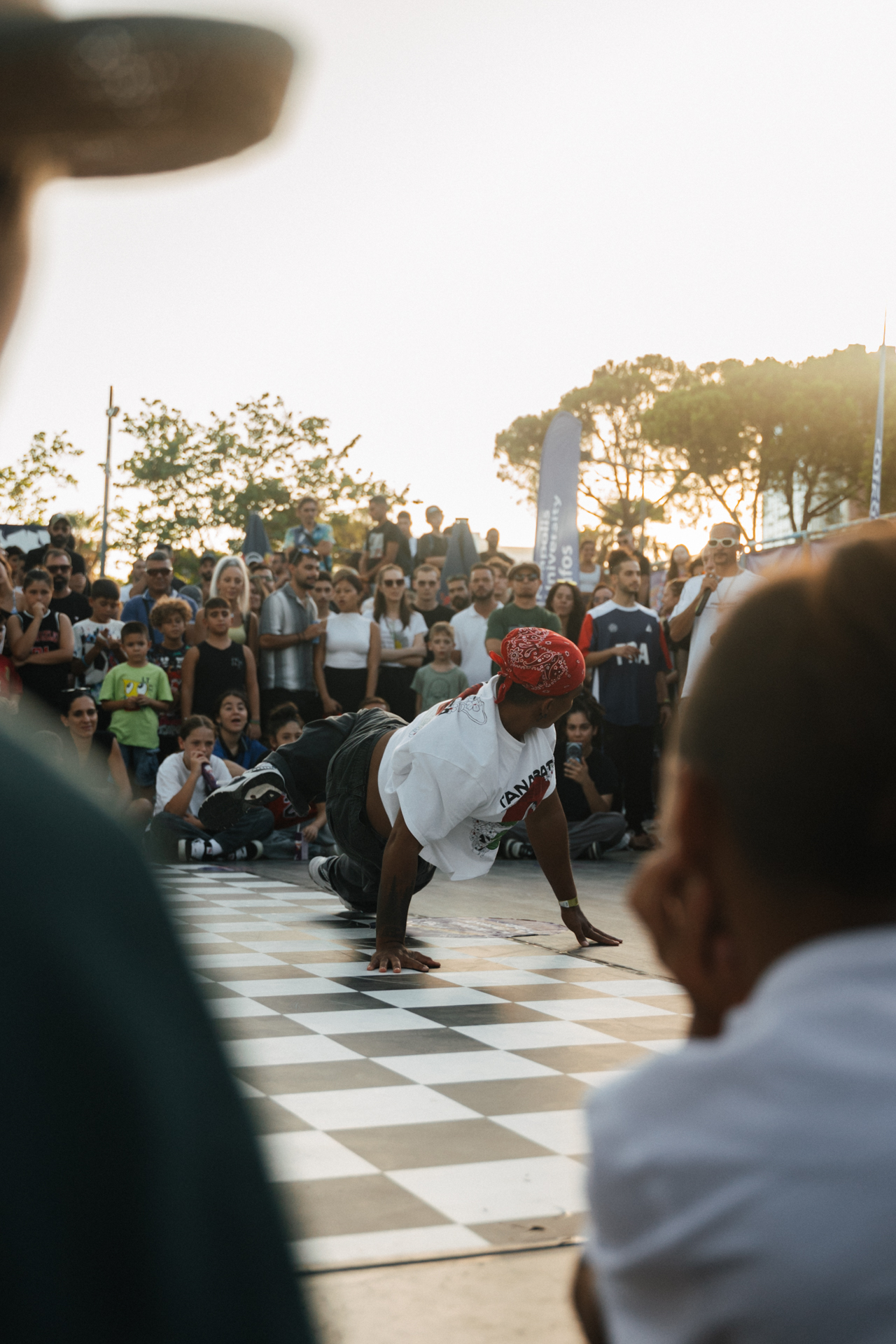 Breakdancer performing in front of crowd at outdoor street event in Limassol, Cyprus