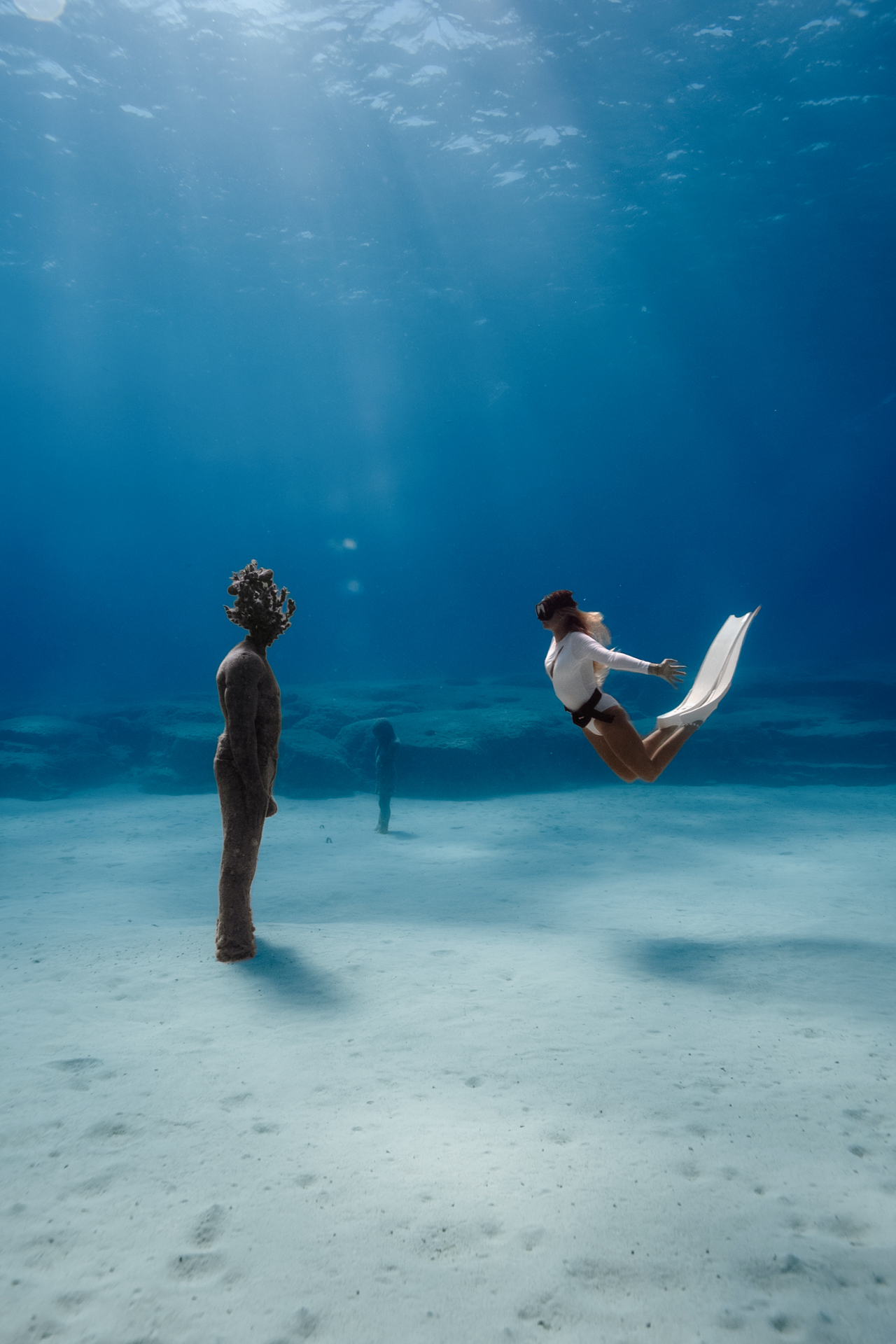Freediver exploring statues at MUSAN underwater museum, Cyprus