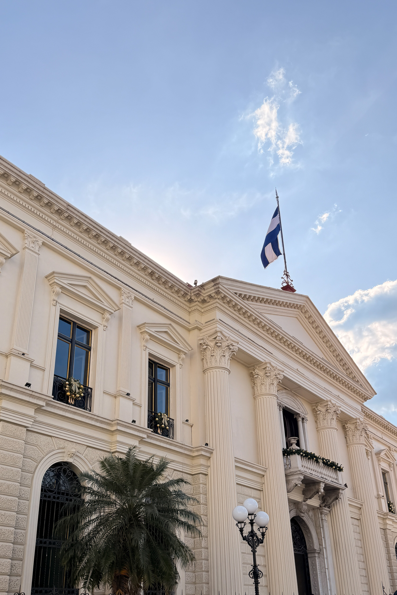 National Palace of El Salvador with neoclassical columns and flag in San Salvador