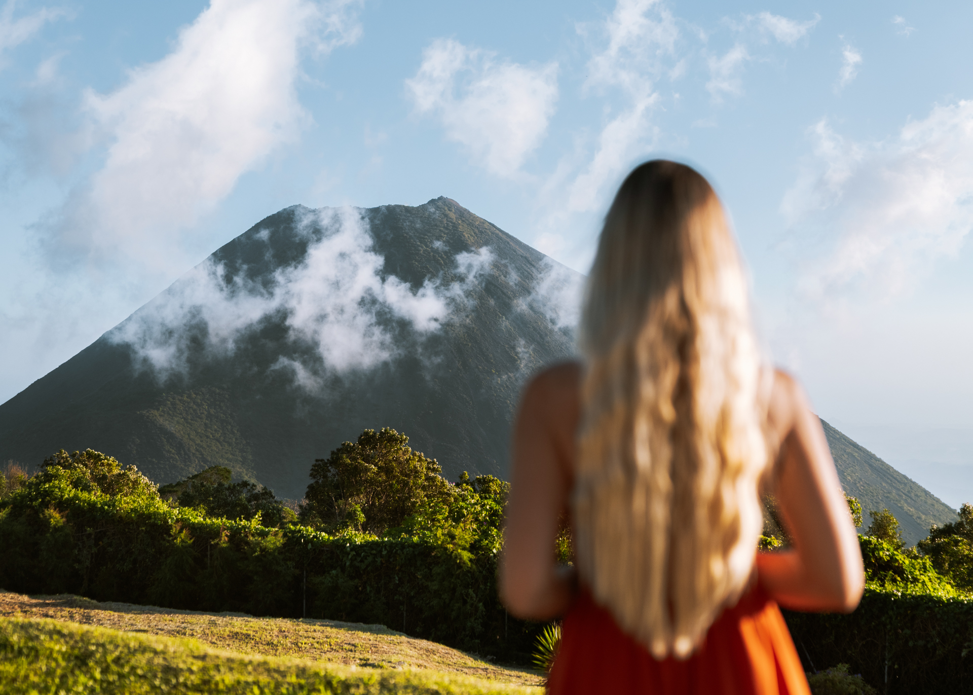 Woman overlooking a volcano in El Salvador