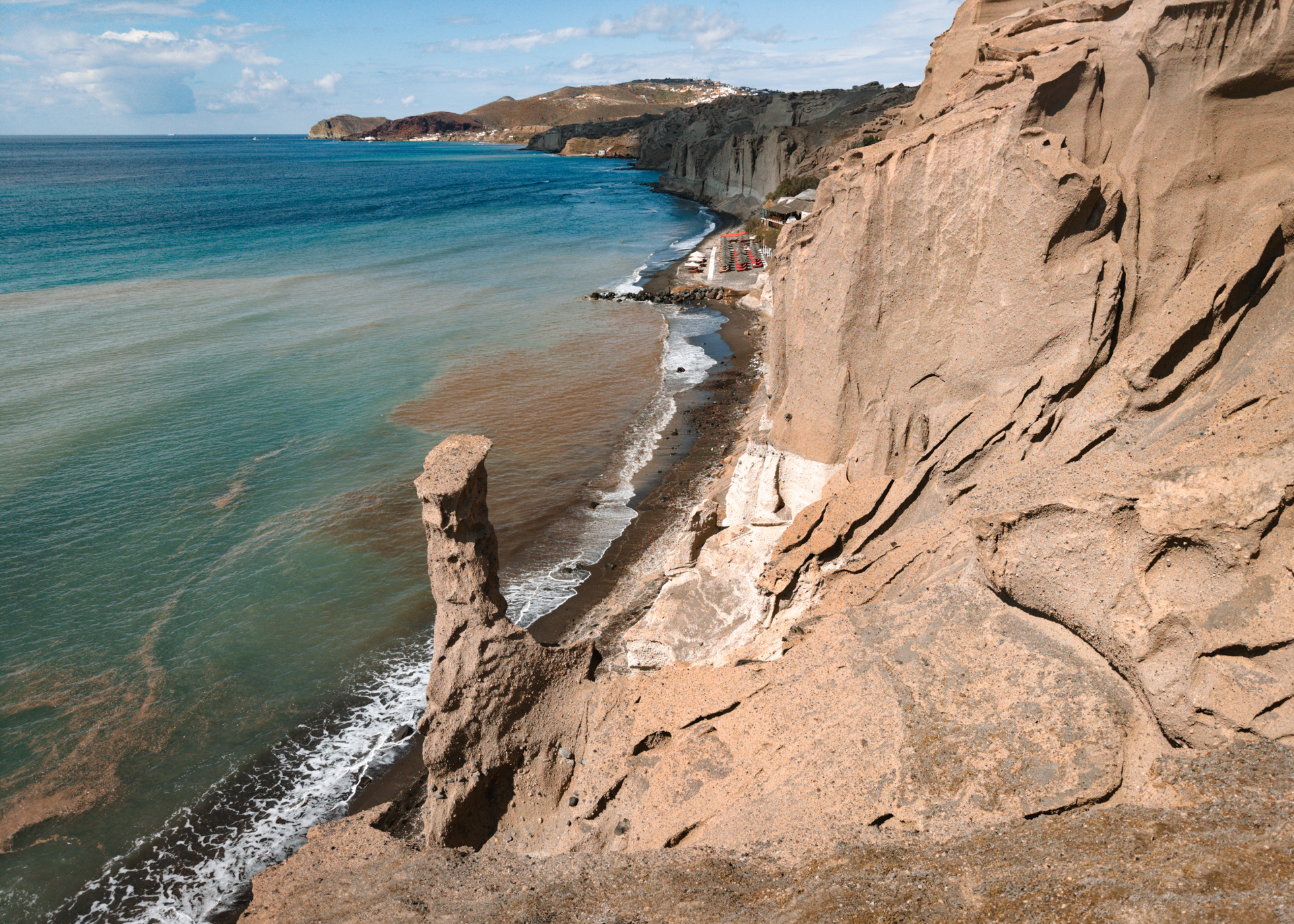 Eros Beach Santorini with unique white cliffs and volcanic coastline by the sea