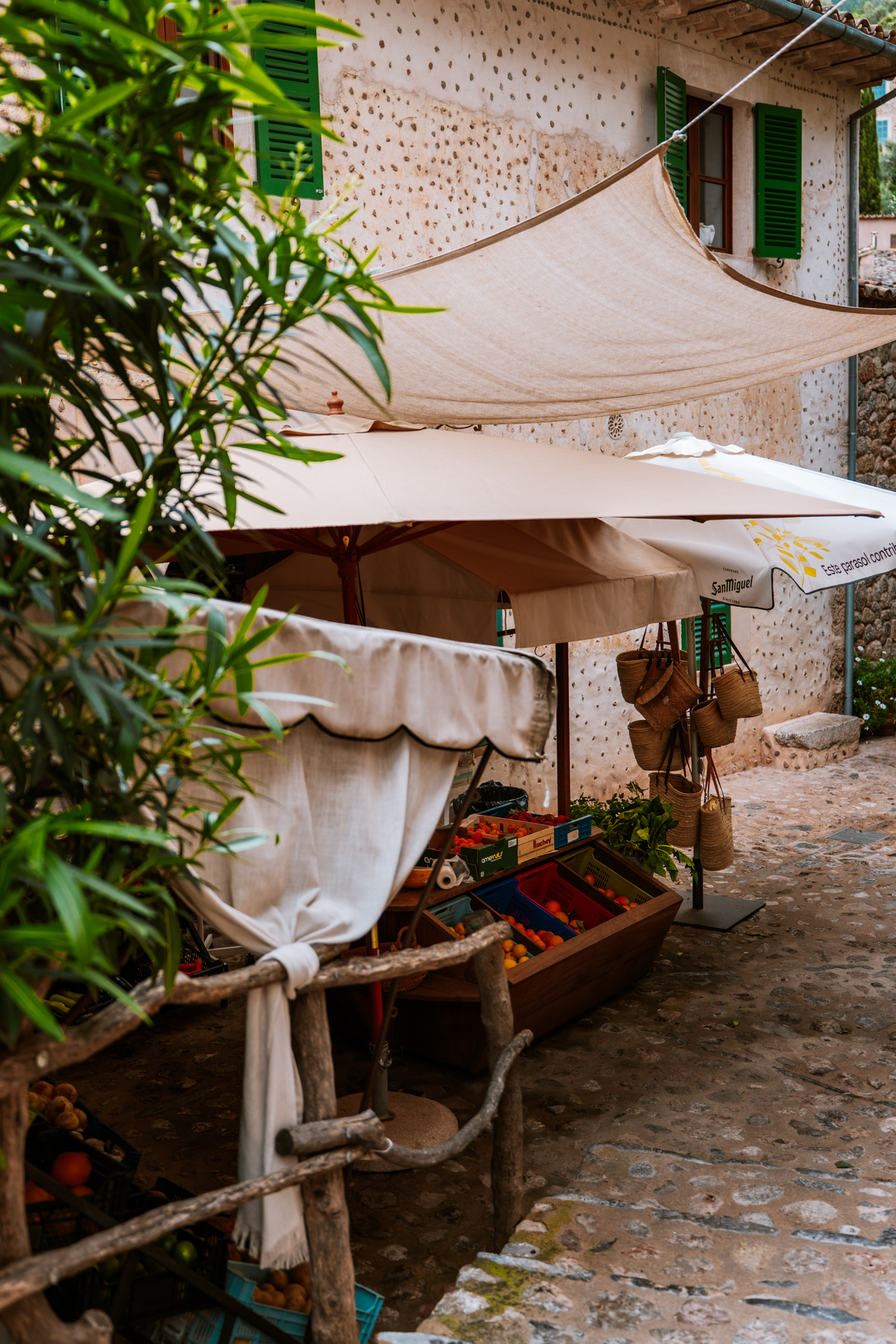 Rustic fruit stand and artisan market alley in Deià village, Mallorca
