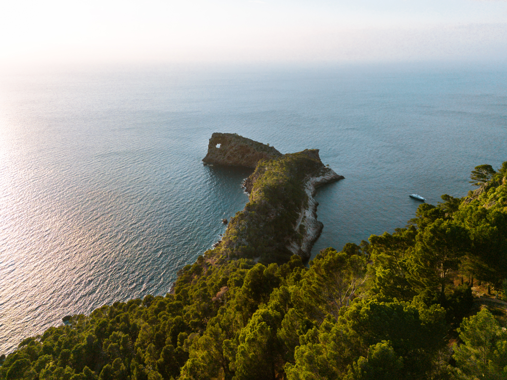 Aerial view of Sa Foradada peninsula at sunset in Mallorca, Spain