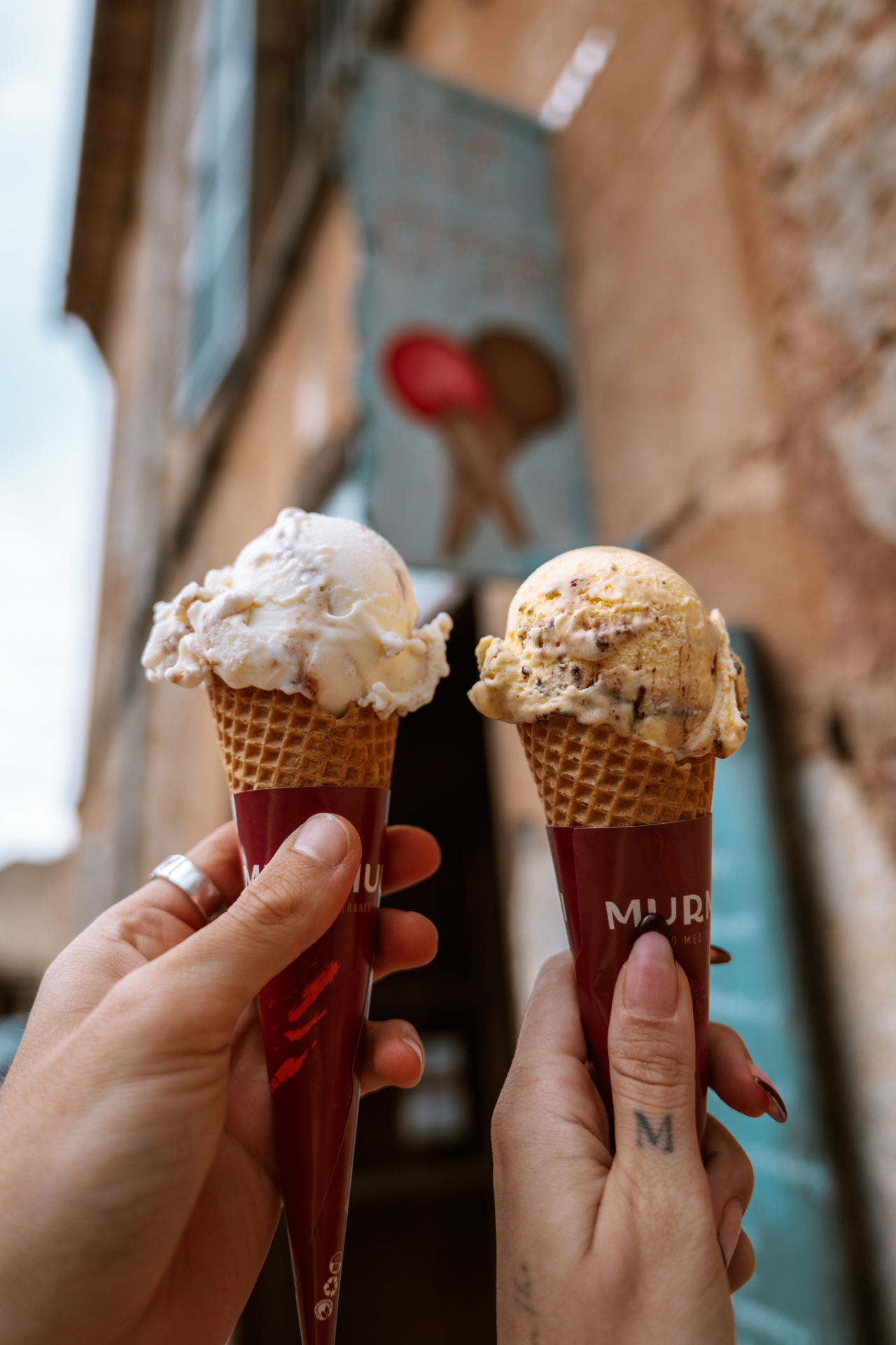 Gelato cones in charming Deià village street, Mallorca, Spain